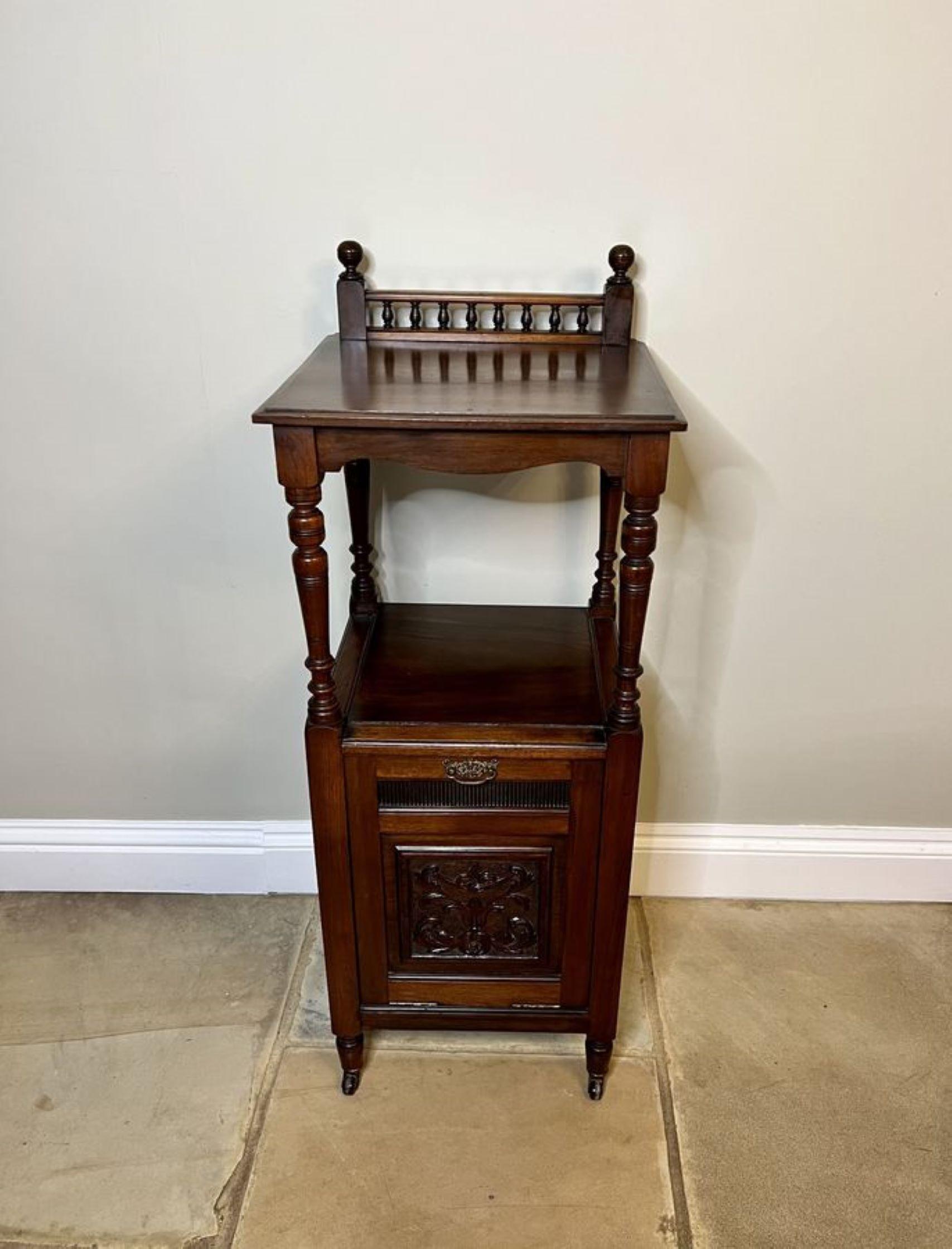 Antique Victorian quality carved mahogany coal box having a quality mahogany top with a gallery back supported by turned columns above a carved mahogany pull down front with the original brass handle opening to reveal a compartment for coal,