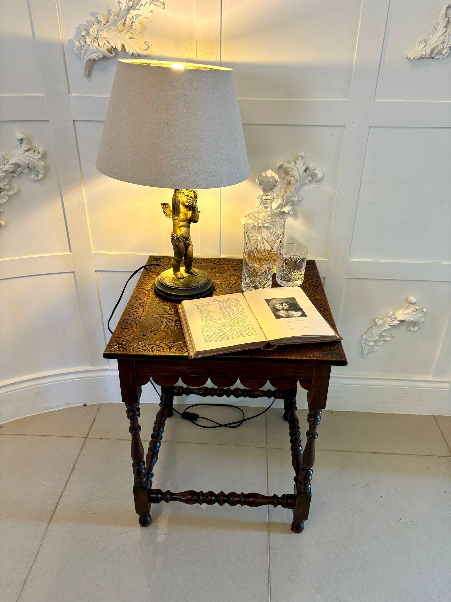 Antique Victorian quality carved oak lamp table having a quality carved oak square top with leaves and sunflowers, shaped apron supported by four elegant turned columns standing on turned feet and united by turned stretchers.

Dimensions:
Height 61