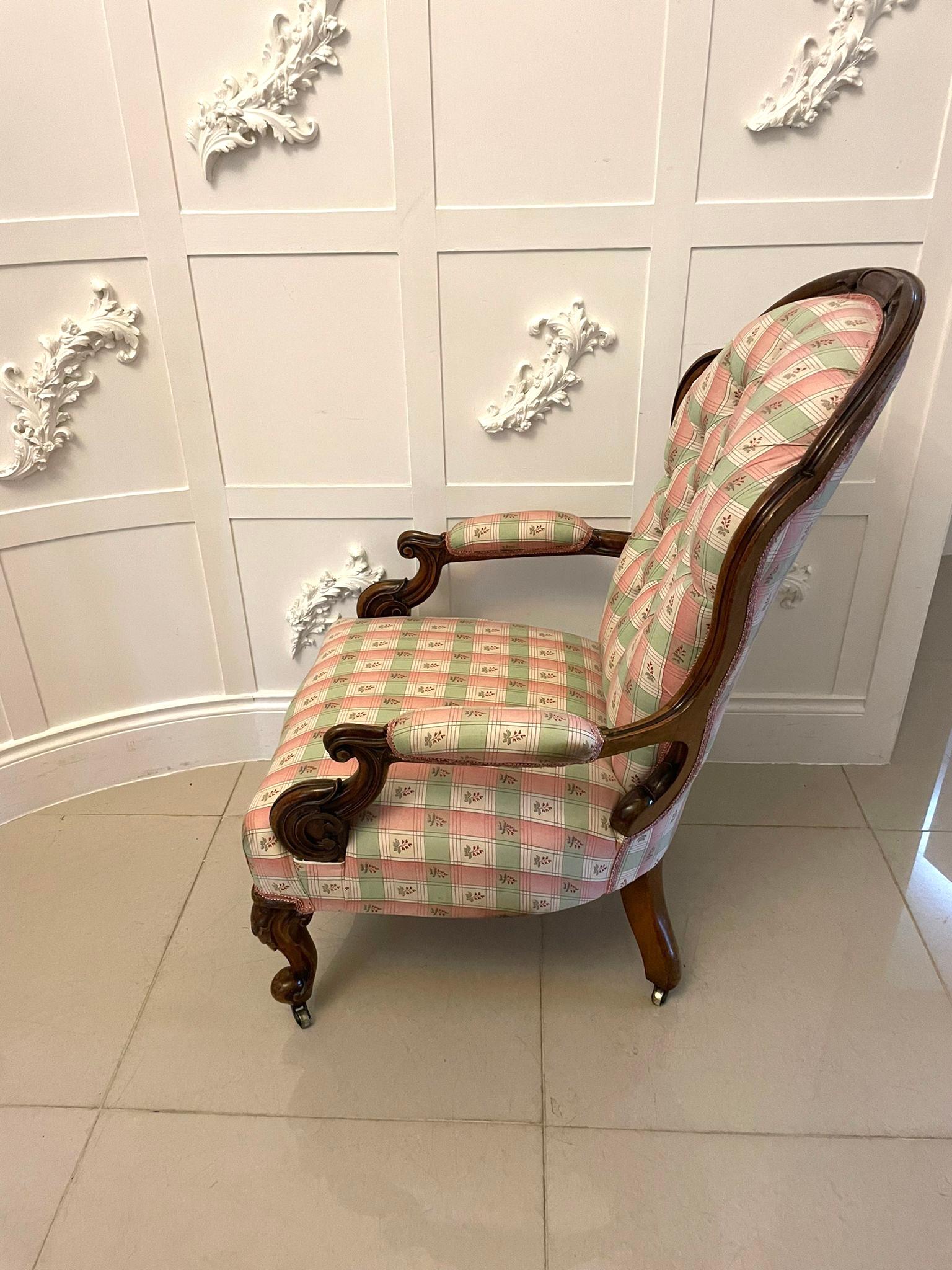 Antique Victorian quality carved walnut armchair having a quality carved walnut shaped back, carved walnut open arms standing on shaped carved walnut cabriole legs to the front and out swept back legs on original castors, newly reupholstered in a