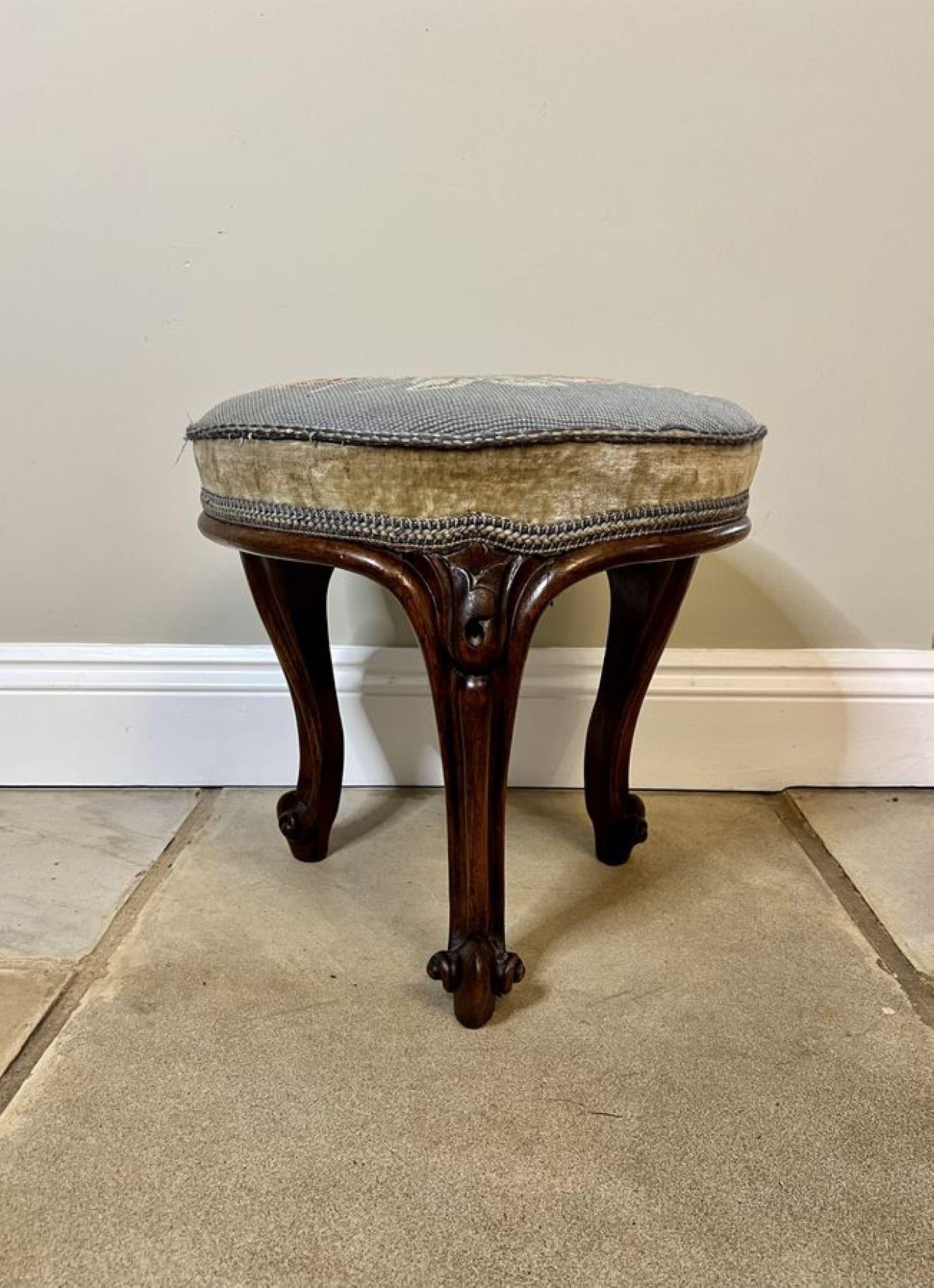 Antique Victorian quality carved walnut stool having a circular shaped upholstered seat supported by three shaped carved walnut cabriole legs with scroll feet.

D. 1860