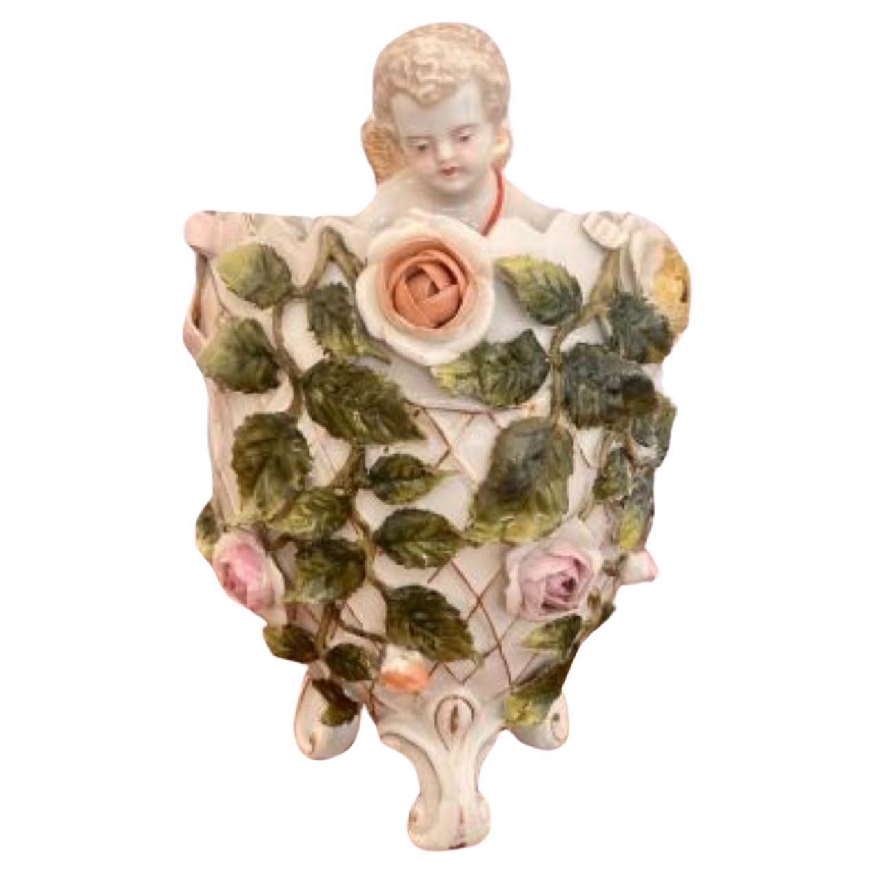 Antique Victorian quality continental porcelain cherub in a vase