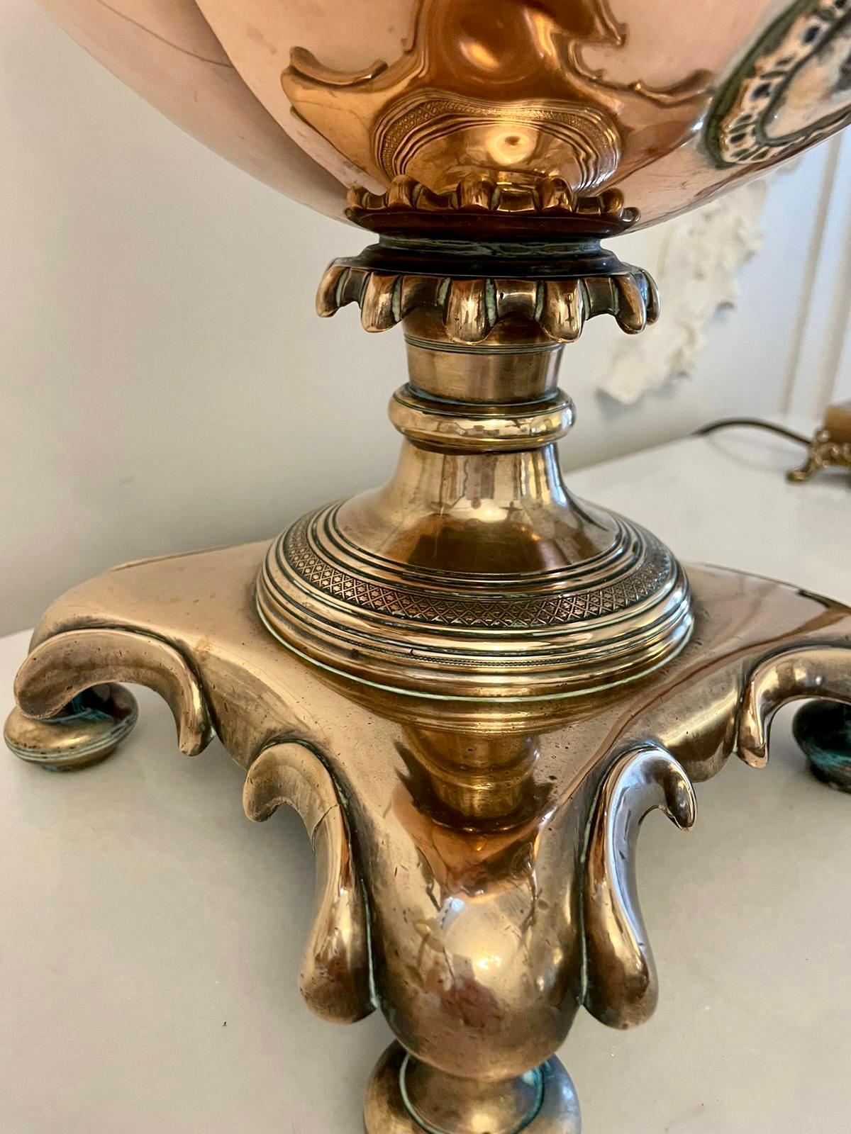 Antique Victorian quality copper and brass samovar/tea urn having an antique Victorian quality ornate copper and brass samovar with a lift off lid, shaped carrying handles, brass tap standing on a ornate base with bun feet

An attractive
