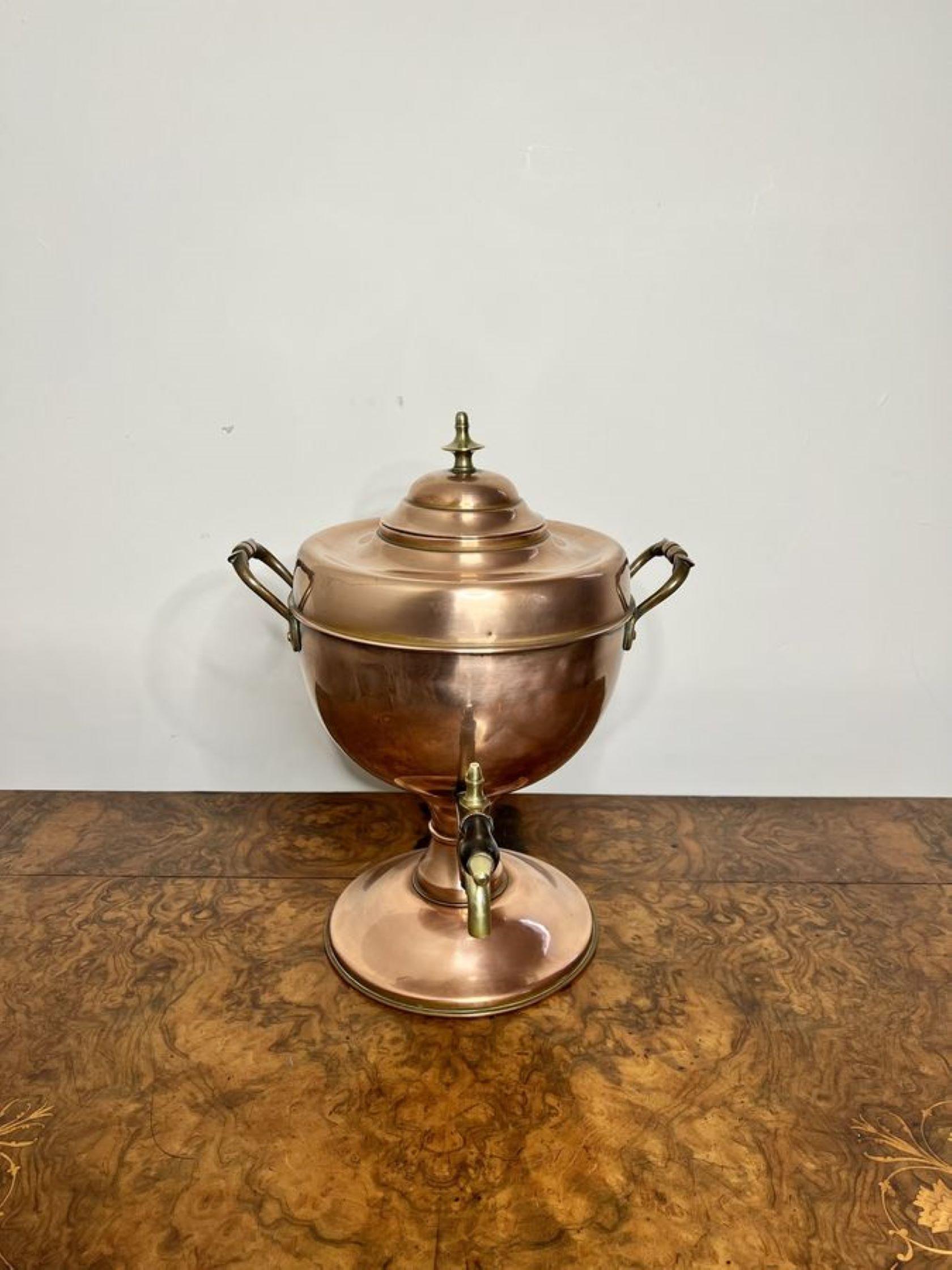 Antique Victorian quality copper & brass samovar having a quality copper samovar with a lift off lid and brass knob, shaped copper handles to the sides, with a brass tap standing on a circular base 

D. 1880