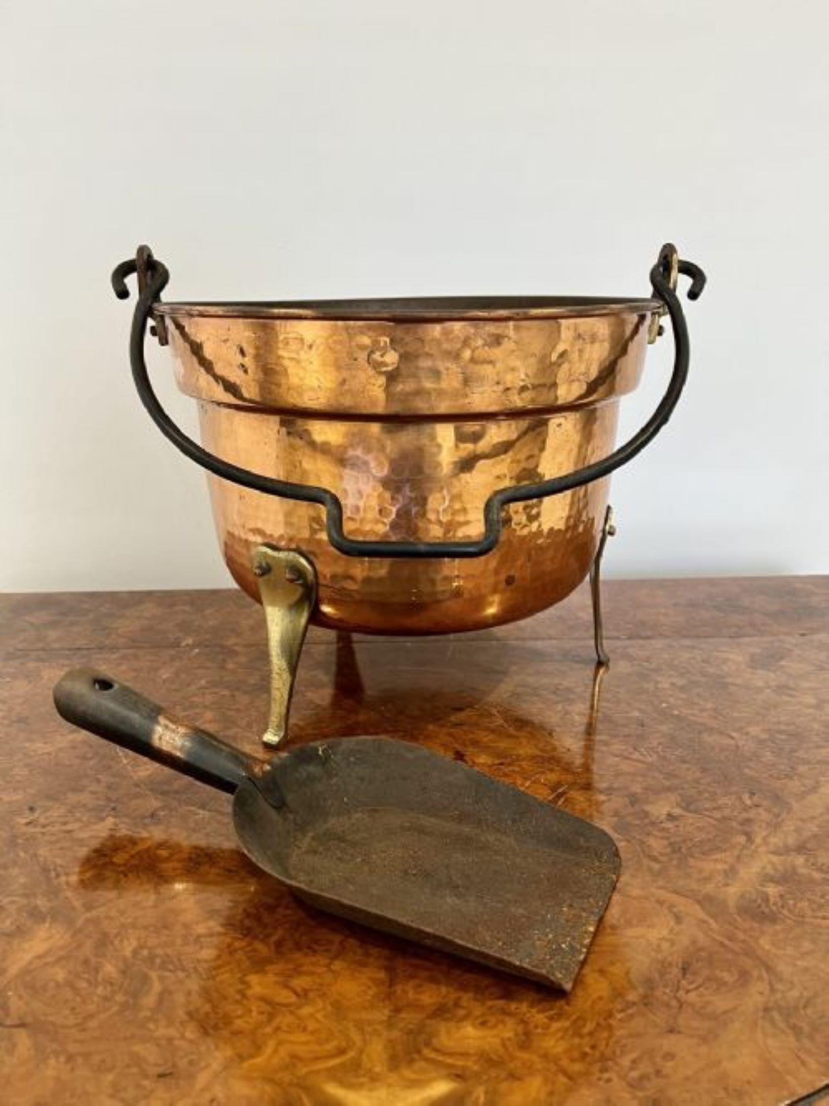 Antique Victorian quality copper coal bucket having a quality shaped iron swing handle above a circular copper coal bucket standing on brass feet