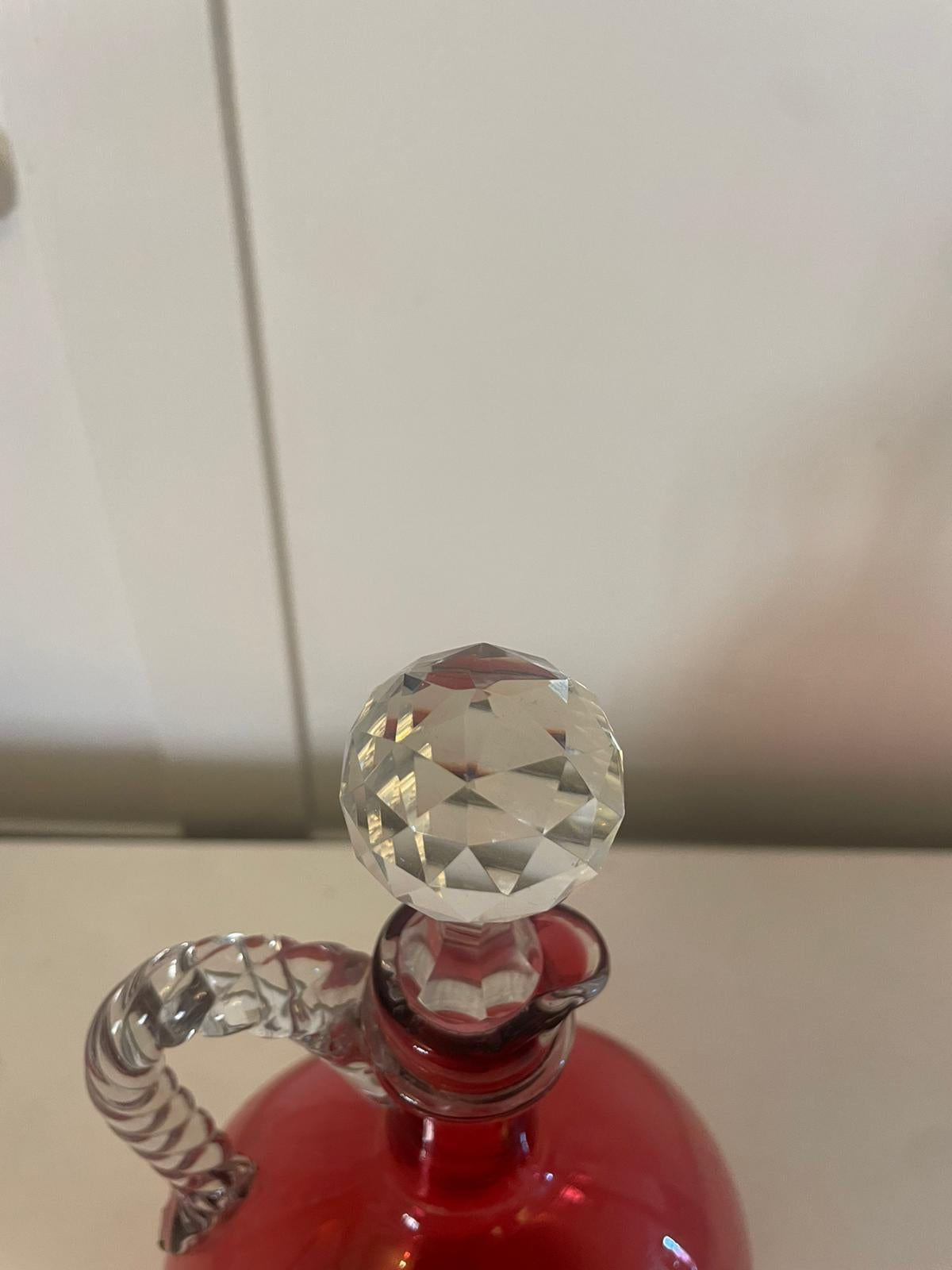 Antique Victorian quality cranberry glass decanter having an unusual rope twist glass handle and original stopper 


A quaint example in perfect original condition


Dimensions:
Height 24.5 cm
Width 14 cm
Depth 9 cm


Dated 1860 
