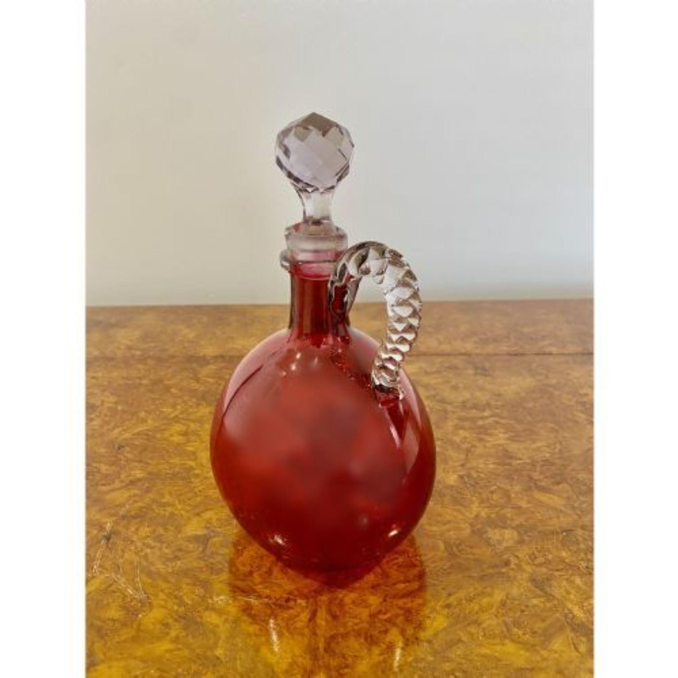 Antique Victorian quality cranberry glass decanter. Quality original Victorian cranberry glass decanter having a twisted glass handle and original glass stopper.