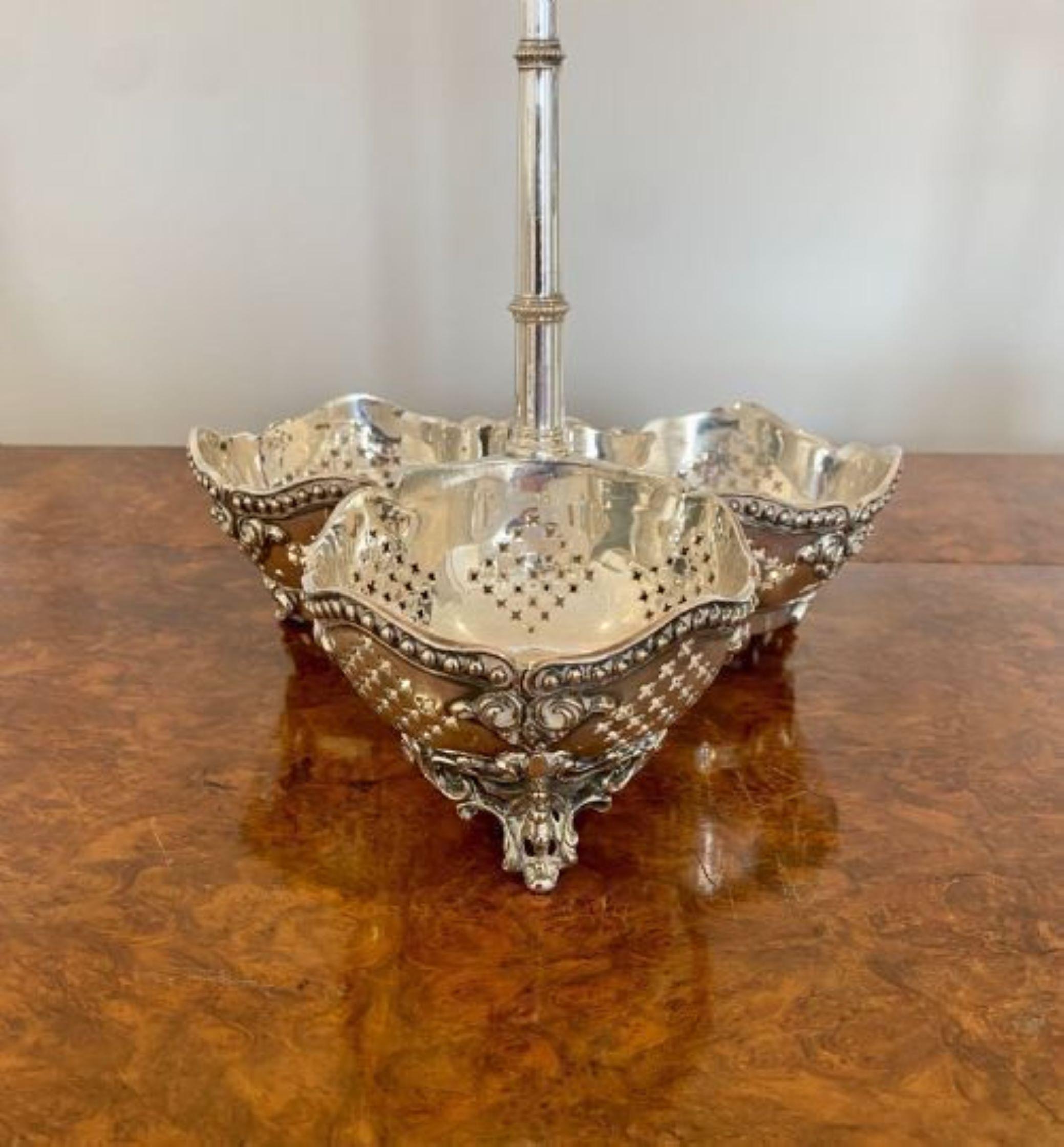 Antique 19th Century Victorian quality cut glass decanters & original silver plated stand consisting of three quality cut glass shaped decanters with three original stoppers in a quality silver plate stand, having a ornate handle and raised on