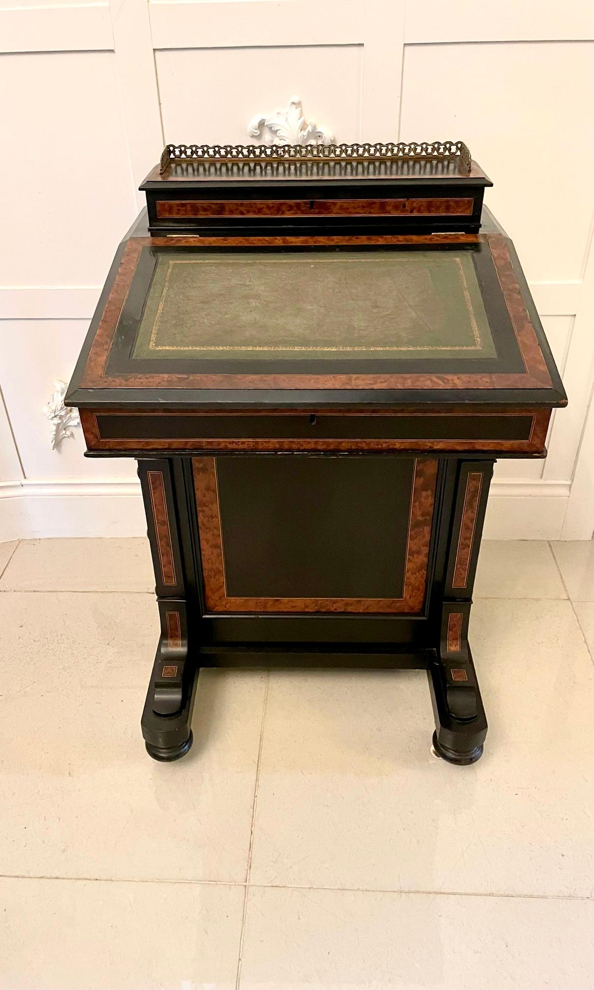 Antique Victorian quality ebonised and walnut crossbanded davenport having a stationery compartment with original brass gallery opening to reveal a fitted interior, foure side drawers and four dummy drawers all crossbanded in walnut and original