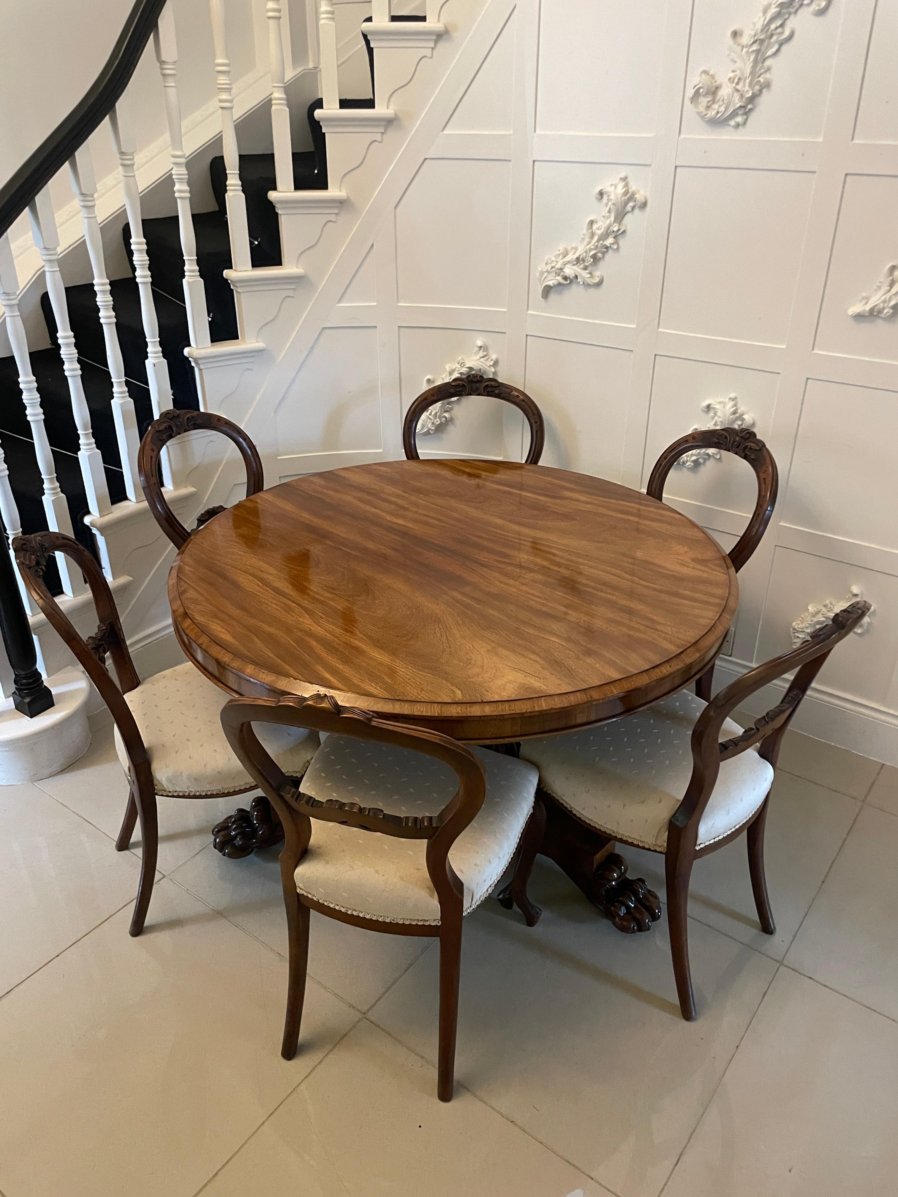 Antique Victorian quality figured mahogany 6 seater dining table having a quality figured mahogany circular top with a moulded edge supported by a mahogany shaped pedestal column with a circular moulded collar standing on a platform base with