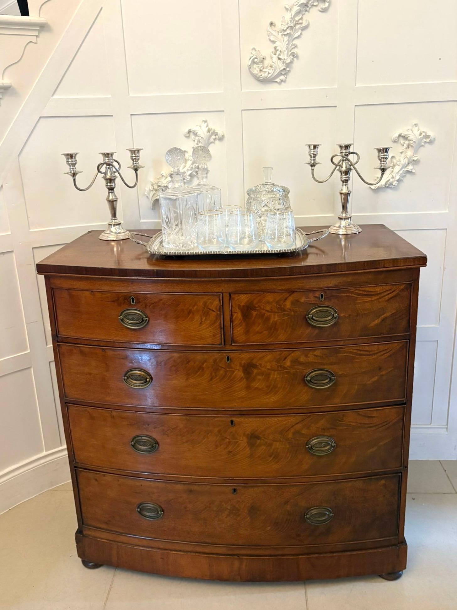 Antique Victorian quality figured mahogany bow fronted chest of 5 drawers having a quality figured mahogany bow fronted top above 2 short and 3 long figured mahogany oak lined cockbeaded drawers with oval brass handles standing on a plinth base with