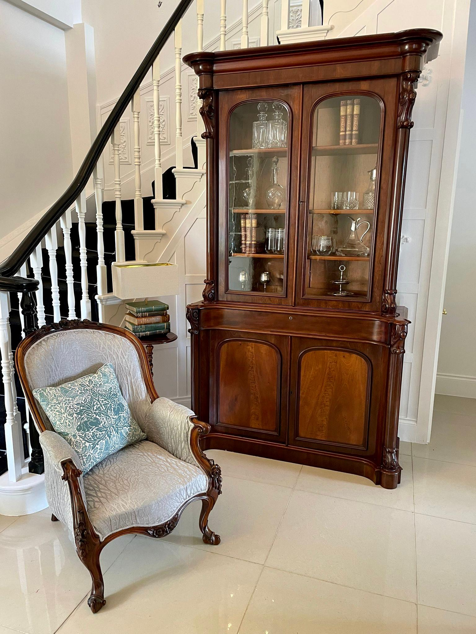Antique Victorian quality figured mahogany library bookcase having a quality moulded shaped cornice above a pair of figured mahogany glazed moulded doors opening to reveal three adjustable shelves, one long frieze drawer above a pair of figured