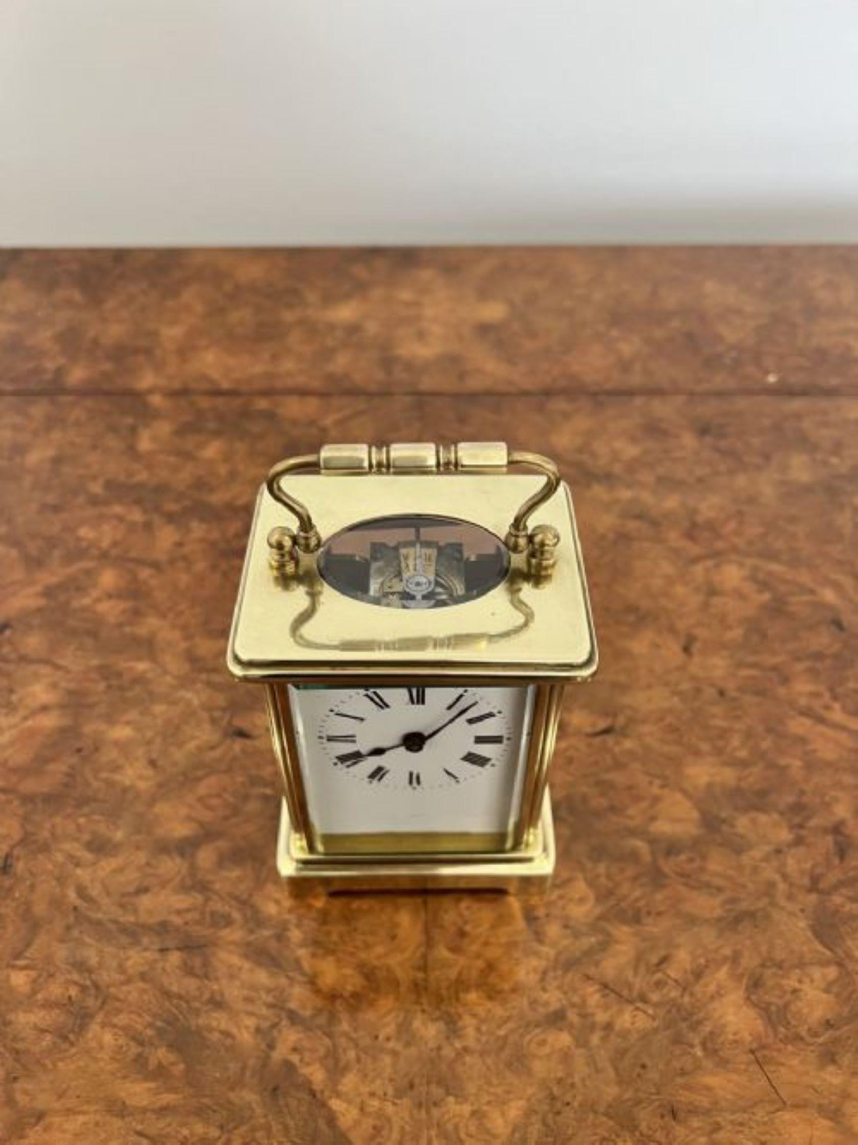Antique Victorian quality French brass carriage clock having a quality brass case with bevelled glass, white enamel dial with original hands and key, eight day French movement and a handle to the top of the case. 
Please note all of our clocks are