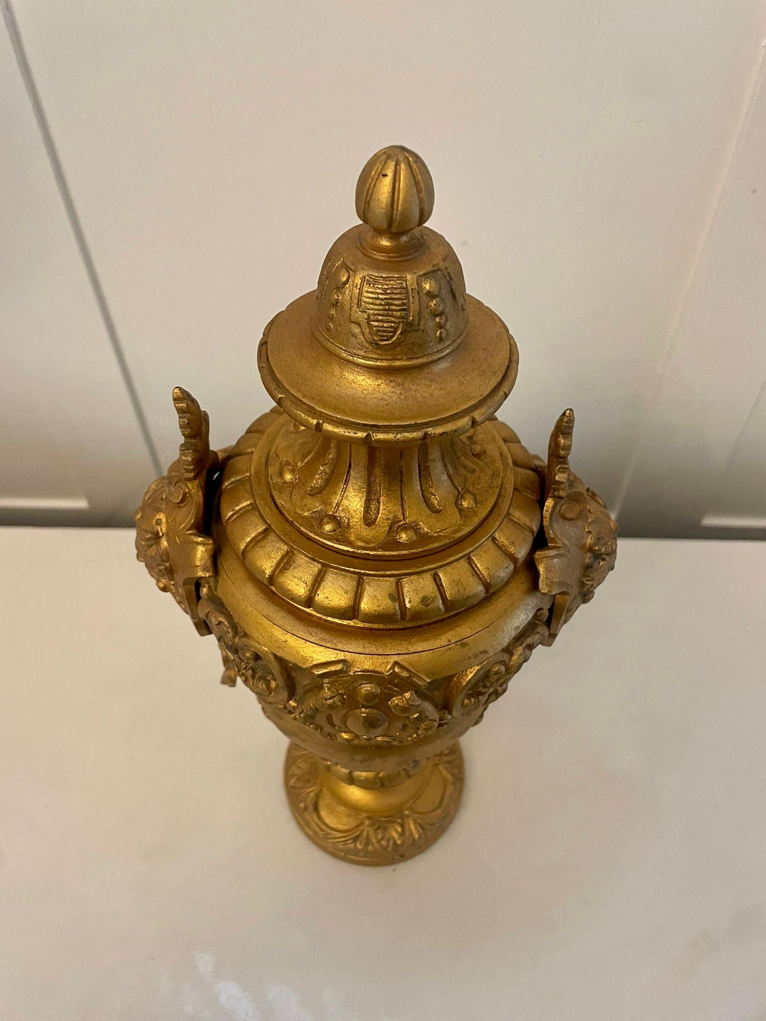 Antique Victorian quality gilded brass urn having an ornate gilded brass urn with swags and scrolls decorated.

A quaint decorative piece

Dimensions:
Height 30 cm ( 11.81 in)
Width 7 cm (2.75 in)
Depth 7 cm (2.75 in)

Dated 1860