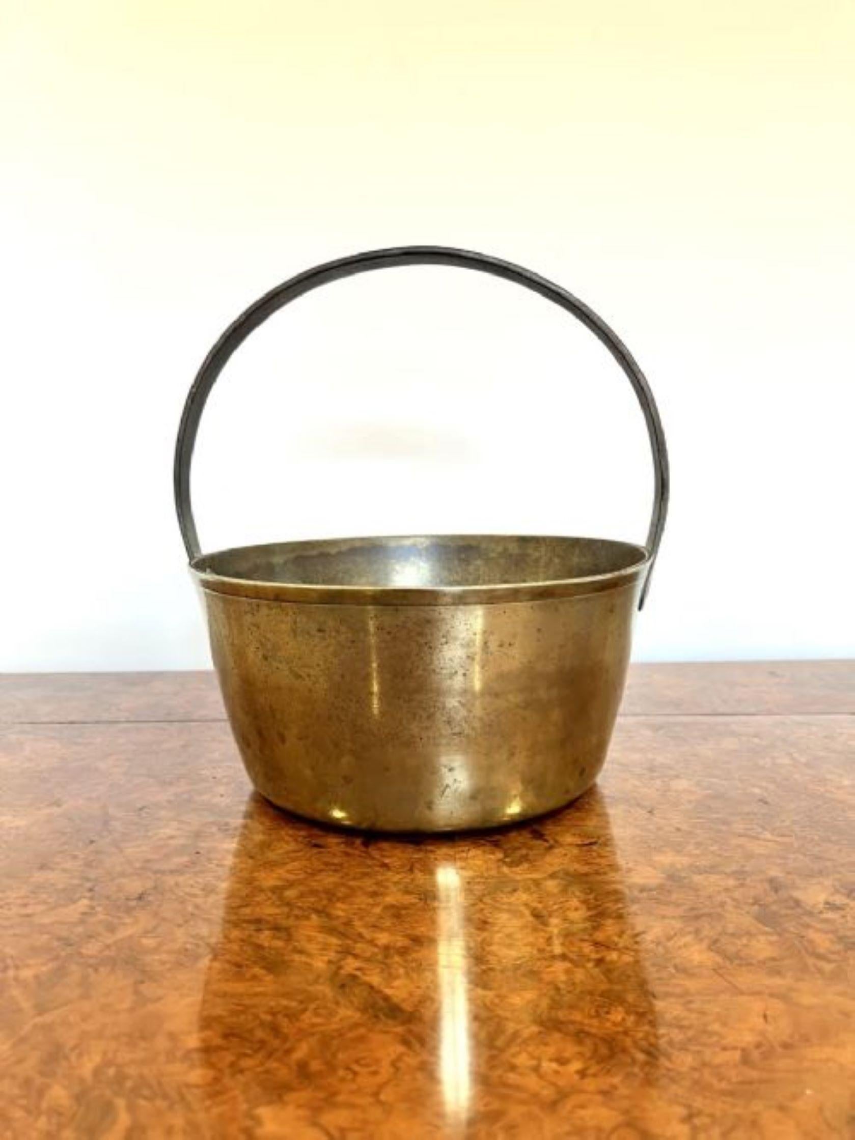 Antique Victorian quality heavy brass jam pale, having an iron shaped handle with a quality brass jam pale. 