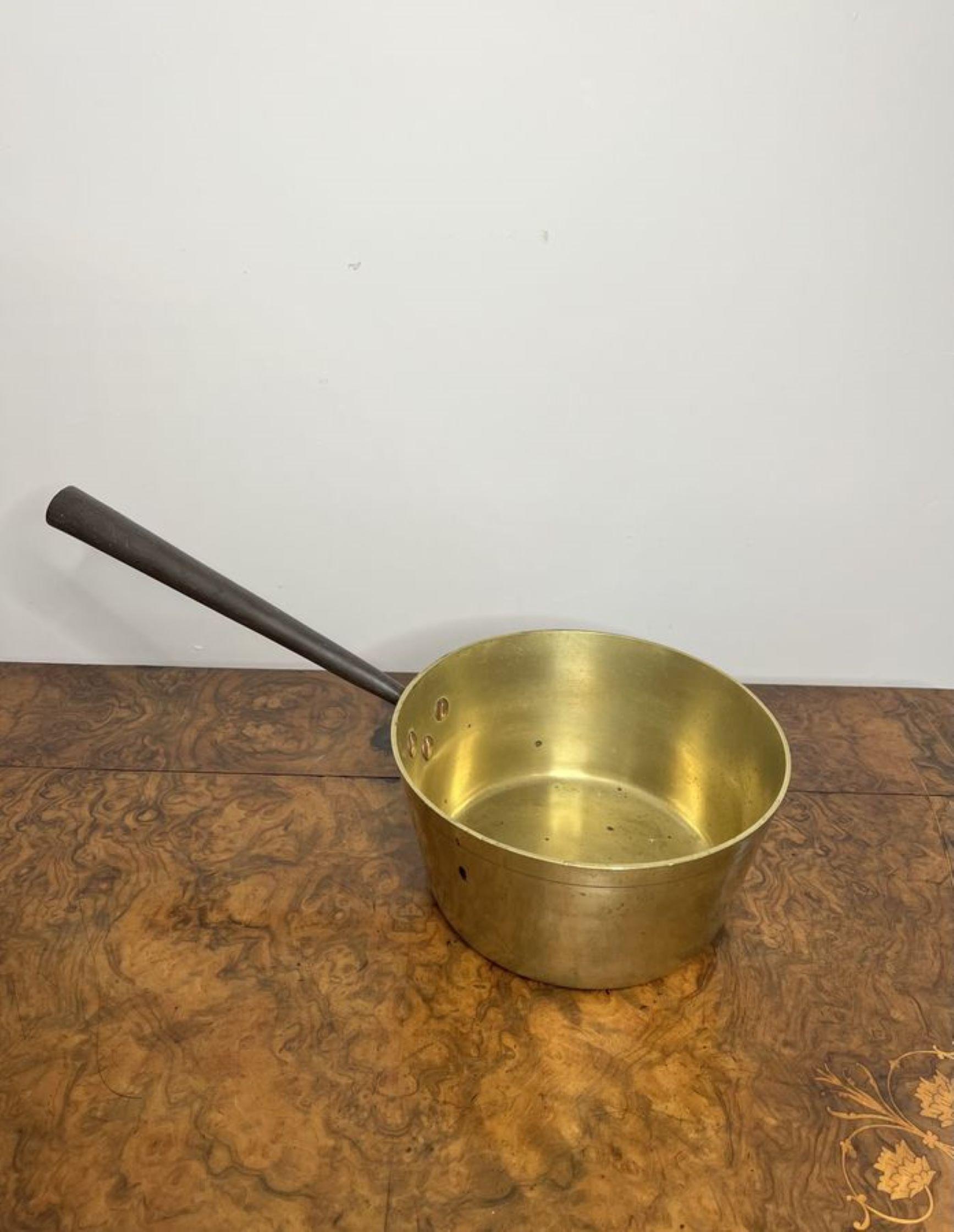 Antique Victorian quality heavy brass jam pan having a quality antique Victorian heavy brass jam pan with a long iron handle to the back.

D. 1860