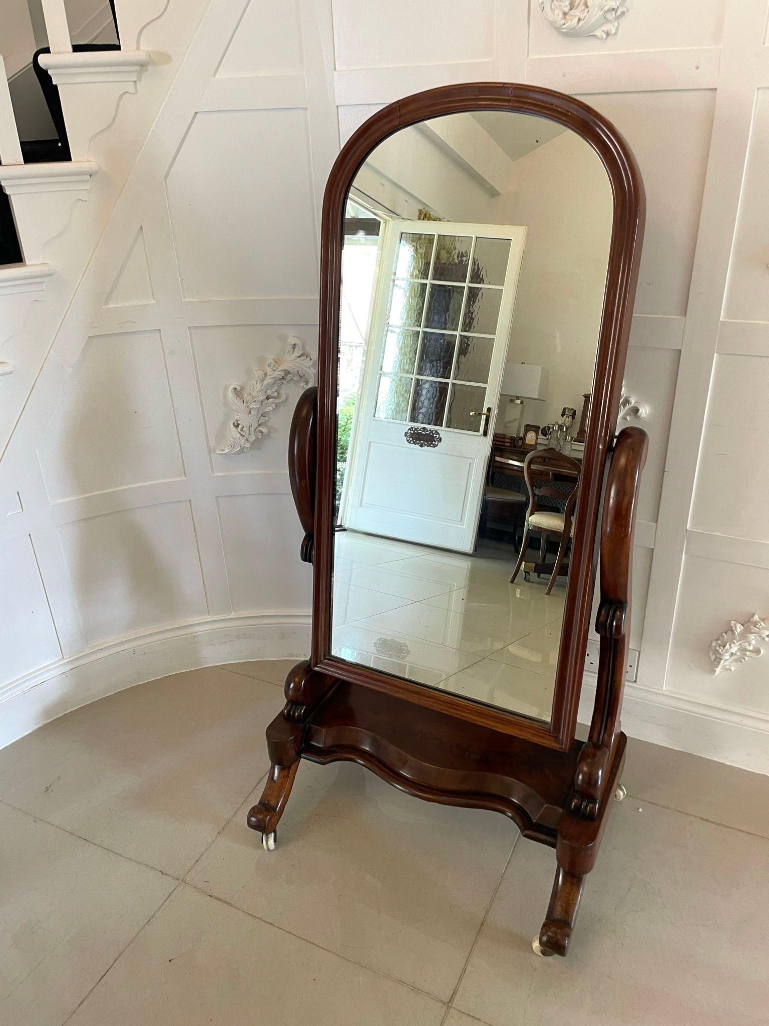 Antique Victorian quality mahogany cheval mirror having the original mirror in an arched top, mahogany frame with a moulded edge supported by scroll shaped supports standing on a serpentine shaped mahogany platform with cabriole legs and scroll feet