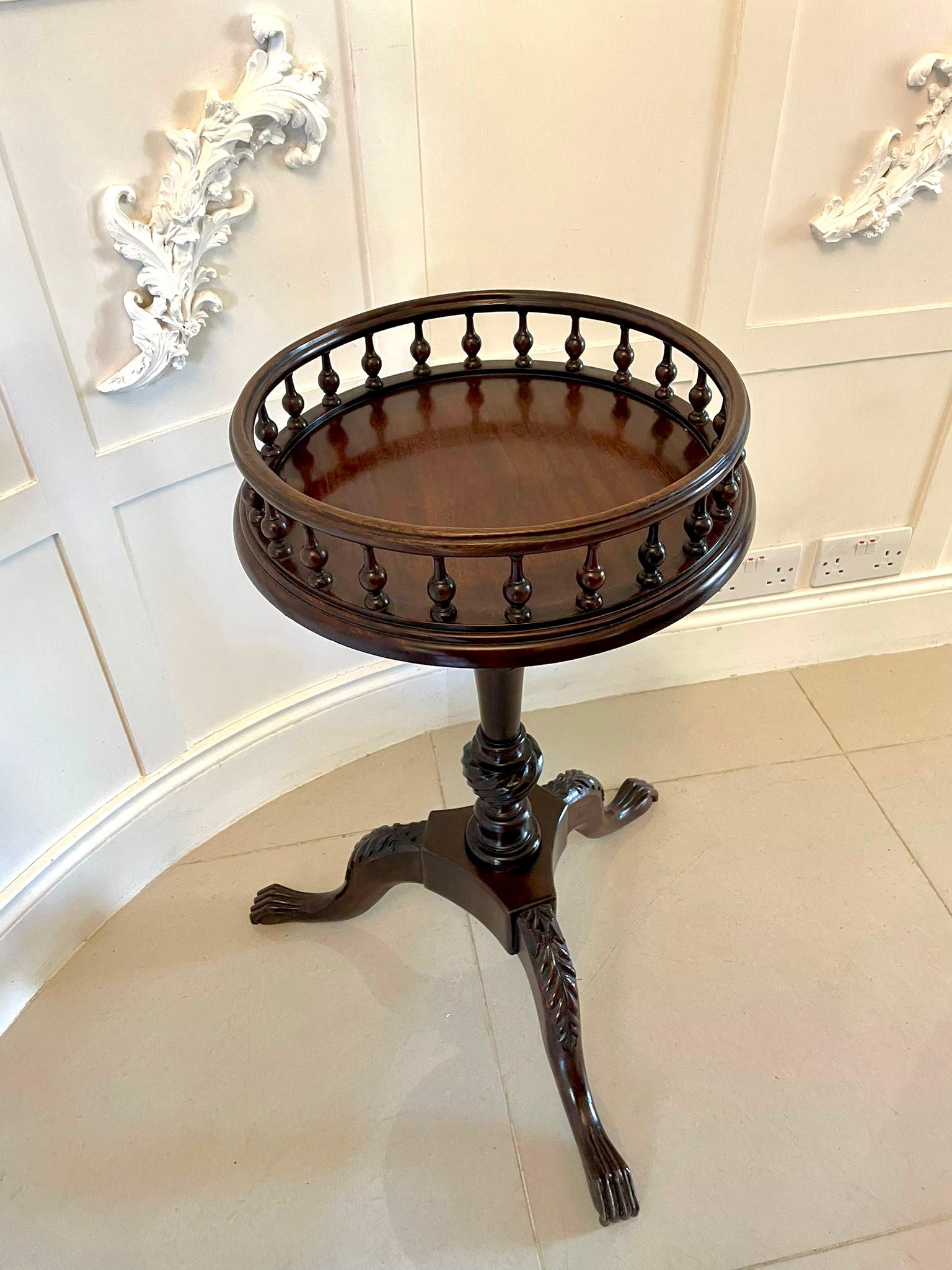 Antique Victorian quality mahogany circular lamp table having a quality circular top with a spindle gallery supported on a superb turned twist tapering column platform base with three shaped carved mahogany cabriole legs with claw feet.

A
