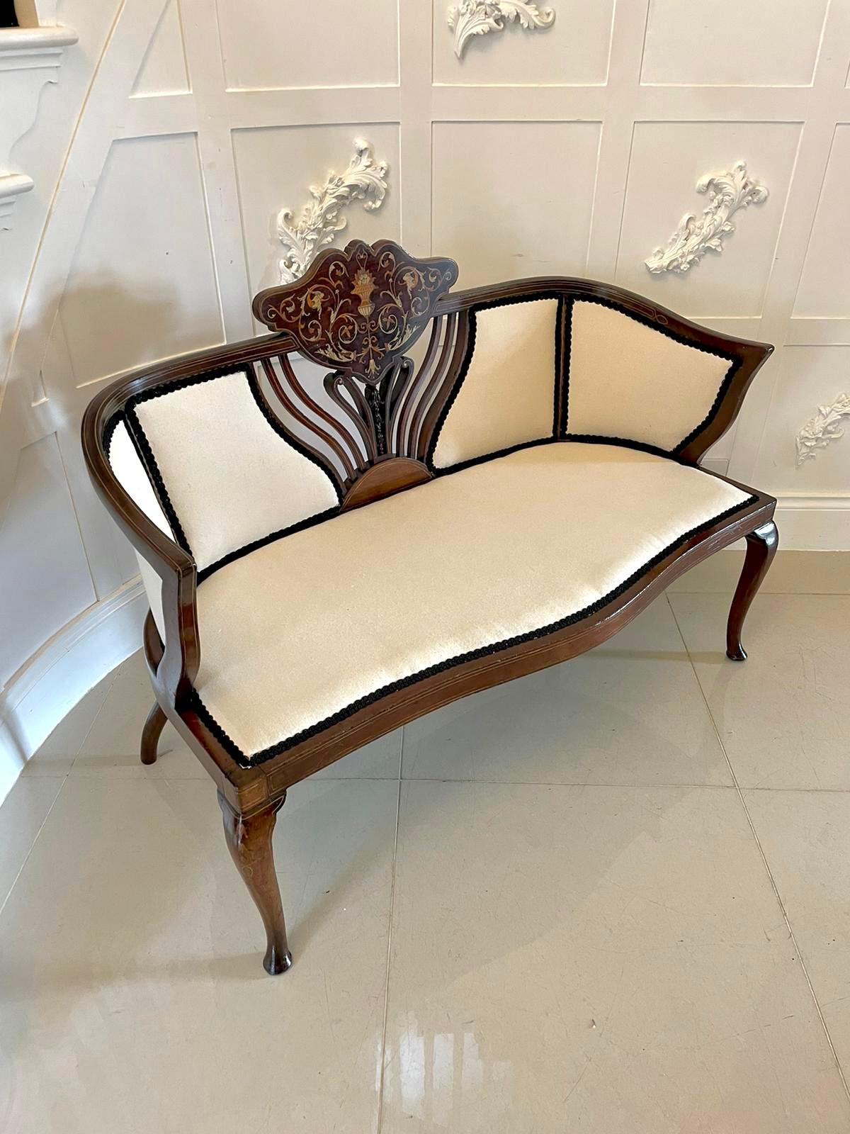 Antique Victorian quality mahogany inlaid settee having a quality mahogany inlaid settee with unusual attractive shaped back, newly reupholstered standing on mahogany inlaid shaped cabriole legs with pad feet to the front and out swept back legs