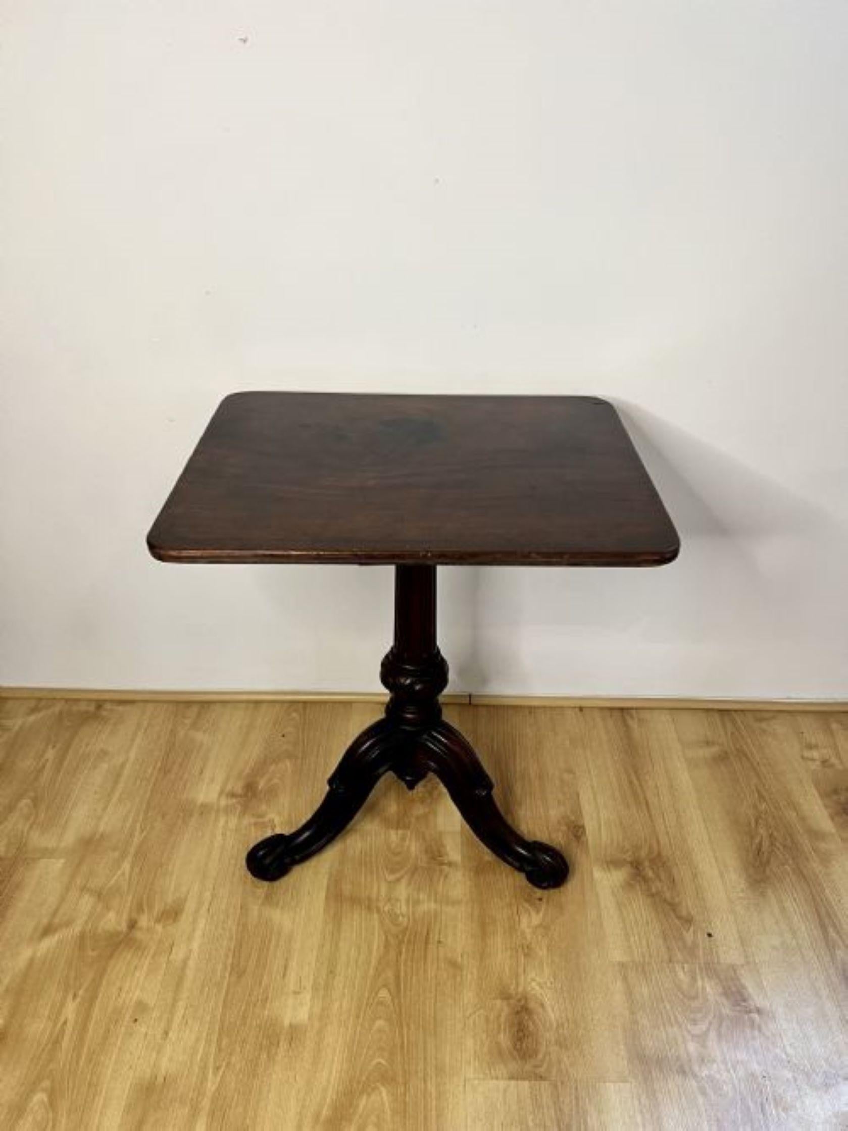 Antique Victorian quality mahogany square top lamp table having a quality mahogany square top supported by a reeded carved tapering pedestal column standing on three carved cabriole legs with scroll feet.