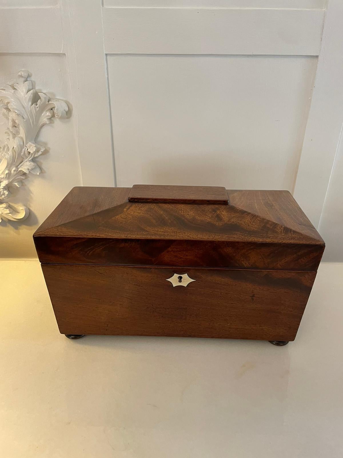 Antique Victorian quality mahogany tea caddy having a quality mahogany lift up top opening to reveal two lidded compartments for tea and a glass mixing bowl standing on original bun feet 
An attractive example in lovely original