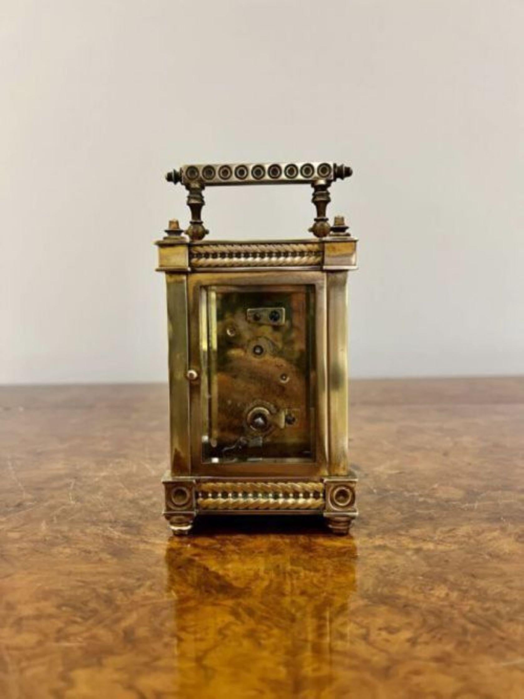 Antique Victorian quality ornate brass French carriage clock having a quality ornate brass and bevelled edge glass carriage clock with a gilded ornate decoration to the front, circular enamel dial with blue numerals and original hands having an 8