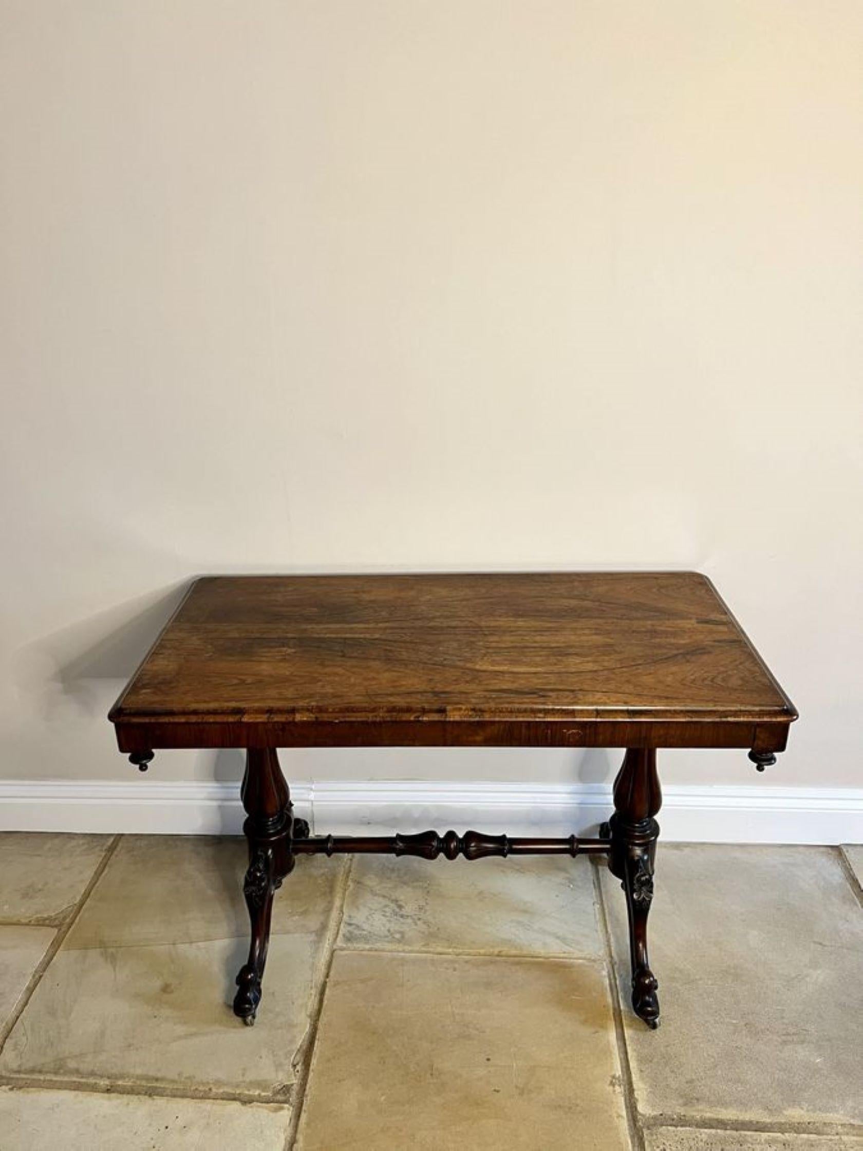 Antique Victorian quality rosewood centre table, having a quality rosewood rectangular shaped top with a moulded edge supported on shaped reeded solid rosewood columns, standing on shaped carved cabriole legs with scroll feet, having the original