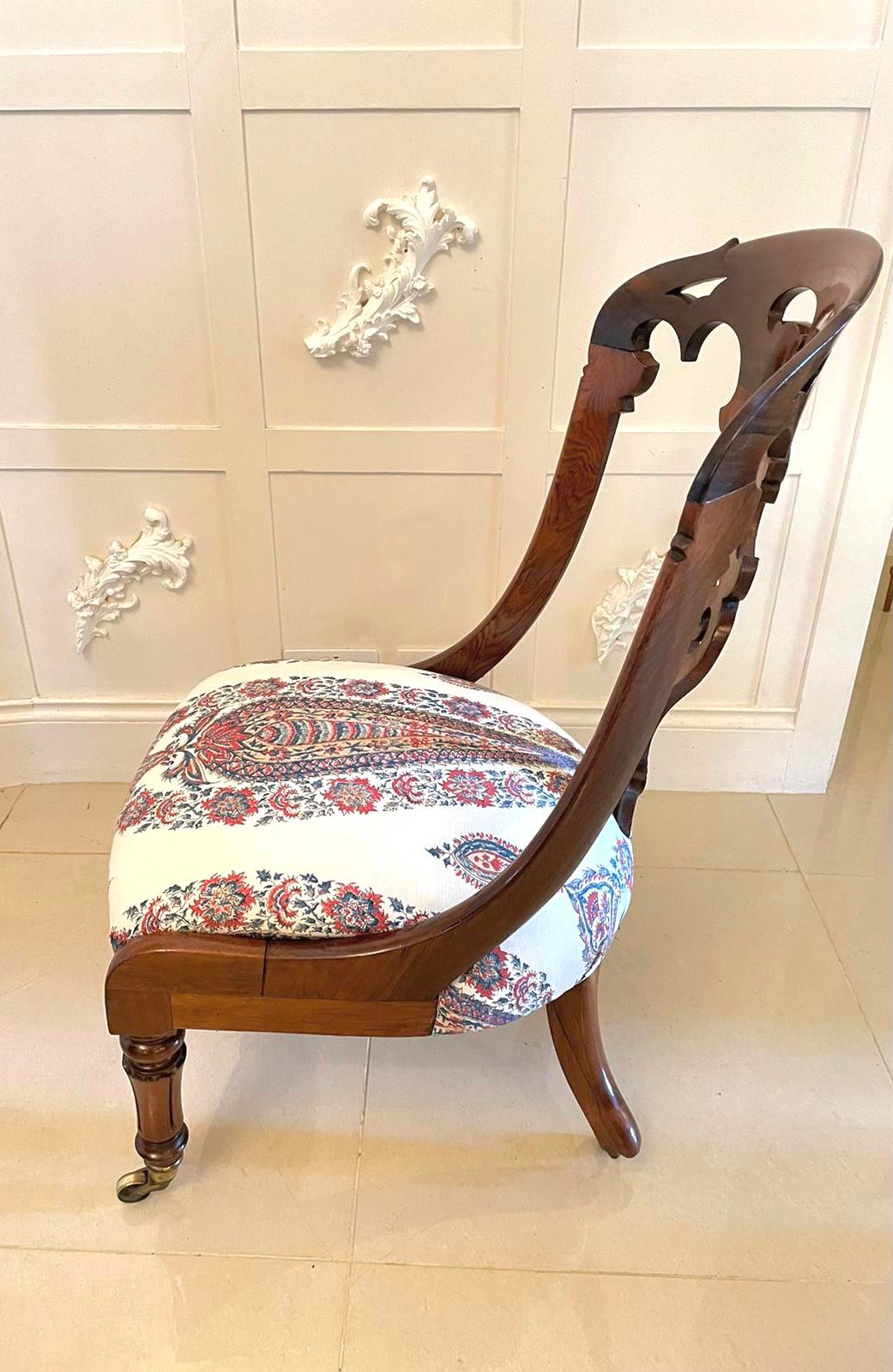 Antique Victorian quality rosewood side chair having a quality rosewood shaped carved centre splat shaped top rail, newly reupholstered seat in a quality fabric and standing on attractive tulip shaped turned legs with original brass castors to the
