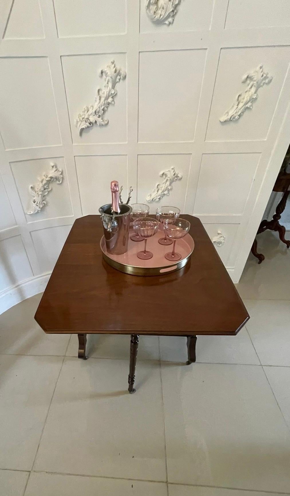 Antique Victorian quality solid walnut Sutherland table having a quality solid walnut top with two drop leaves and a moulded edge supported by turned tapering columns, two swing out legs with original castors standing on shaped cabriole legs united