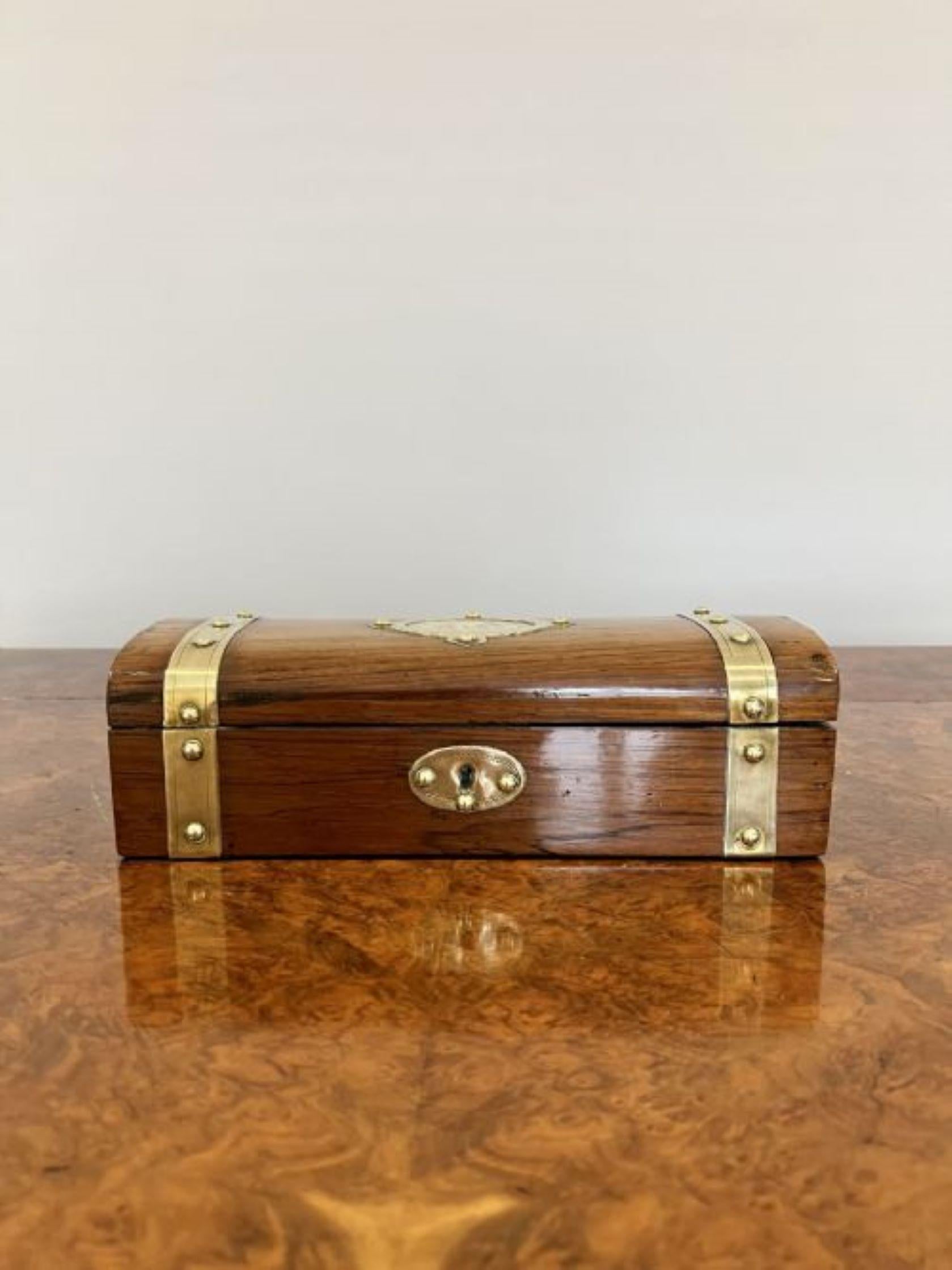 Antique Victorian quality walnut and brass storage box having a quality walnut dome top opening to reveal a storage compartment with purple interior with ornate brass straps 