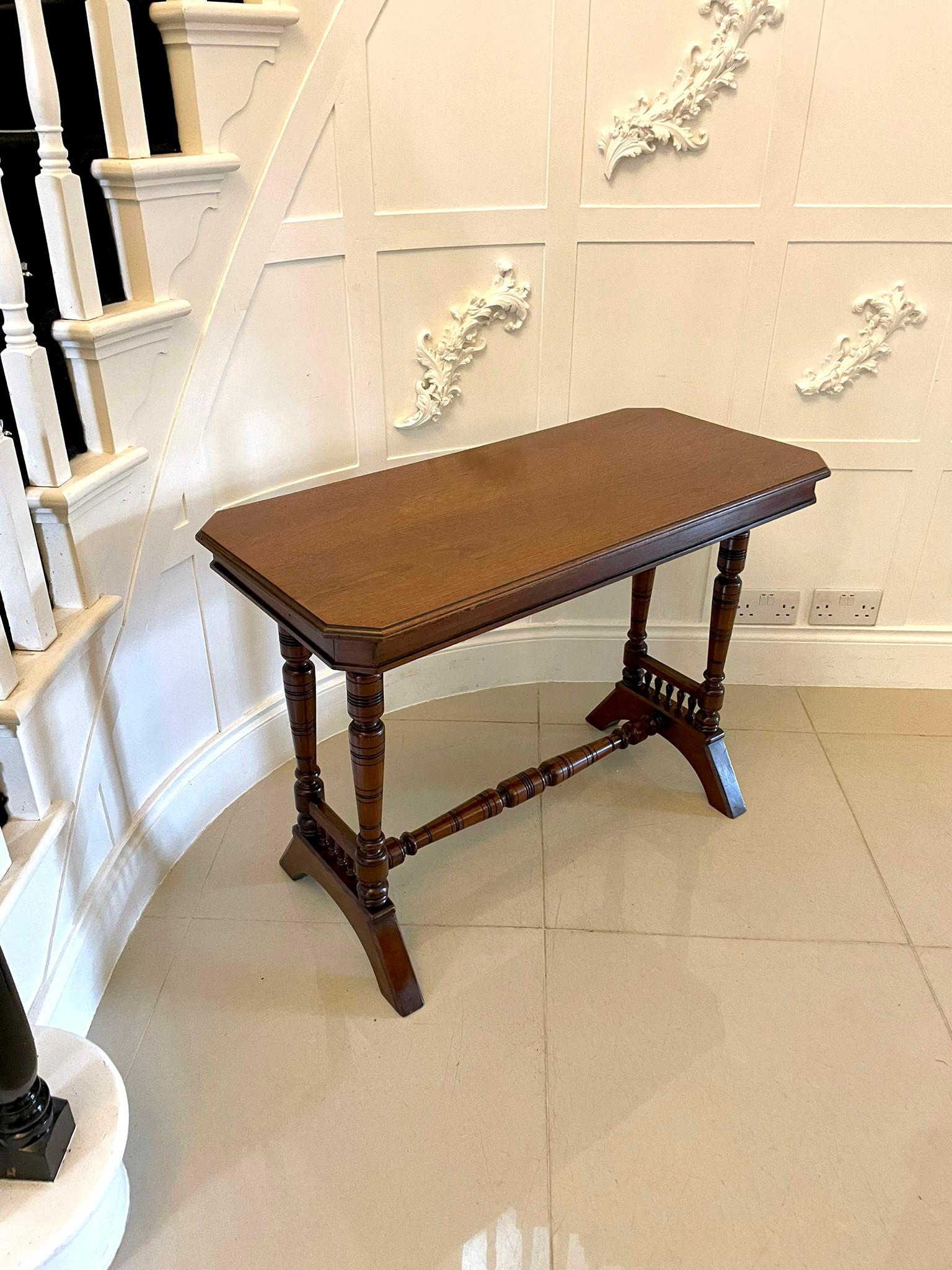 Antique Victorian quality walnut side/lamp table having a quality walnut top with a moulded edge supported by turned tapering columns standing on shaped feet united by a turned tapering stretcher 

A charming example of desirable proportions