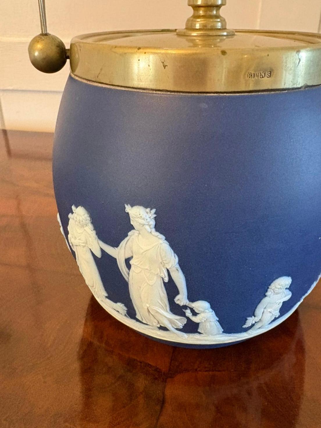 Antique Victorian quality Wedgwood Jasperware biscuit barrel decorated with classical scenes in white cameo with a blue background and boasting a  silver plated swing handle and lid.

Dimensions:
Height 22 cm (8.66 in)
Width 14.5 cm (5.71 in)
Depth