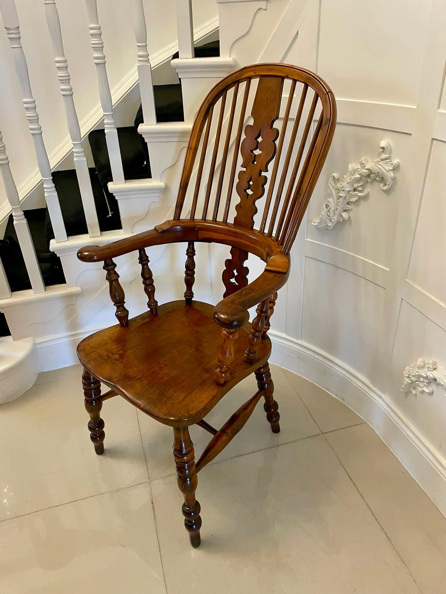 Antique Victorian quality yew wood broad arm Windsor chair having yew wood turned columns and spindles, shaped splat to the back with scroll arms, elm seat and standing on yew wood turned legs united by a turned stretcher 


A very good example