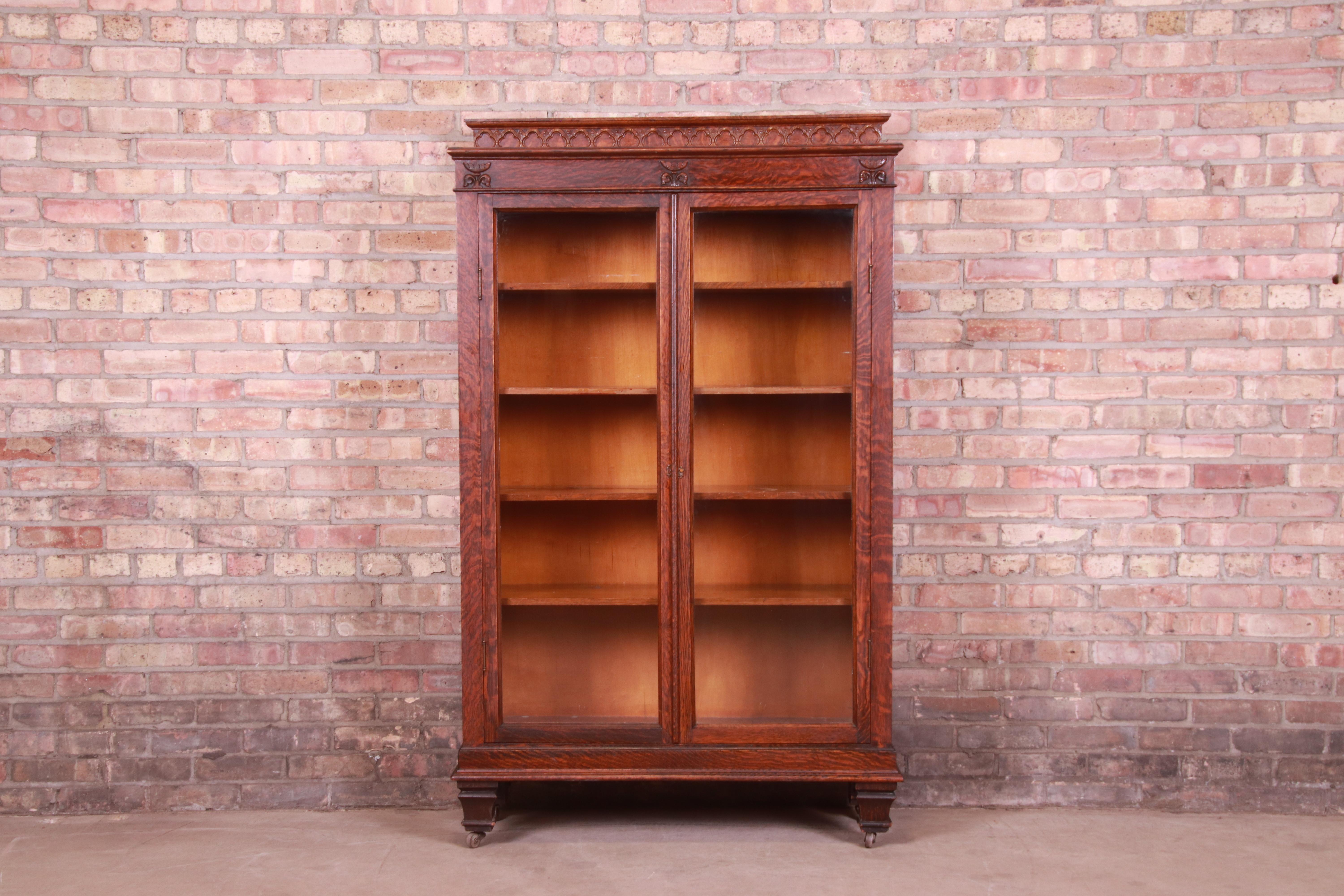 An exceptional antique Victorian bookcase

USA, Circa 1880s

Carved quarter sawn oak, with glass front doors.

Measures: 38.5