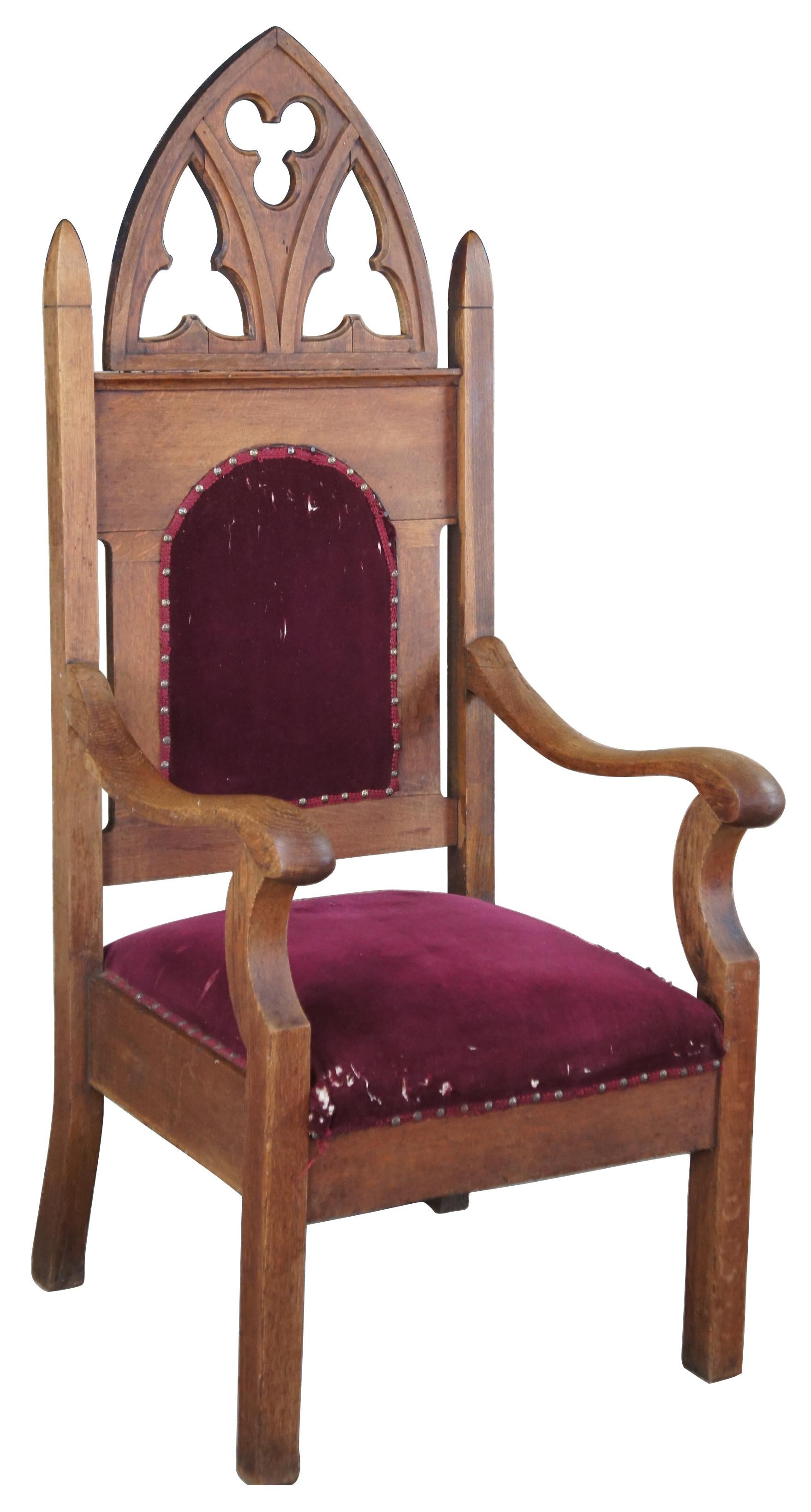 Antique Victorian Gothic Revival Bishops throne chair. Made of oak, featuring serpentine arms and arched back with carved details. Marked Three Pillars, No. 170. Measure: 59