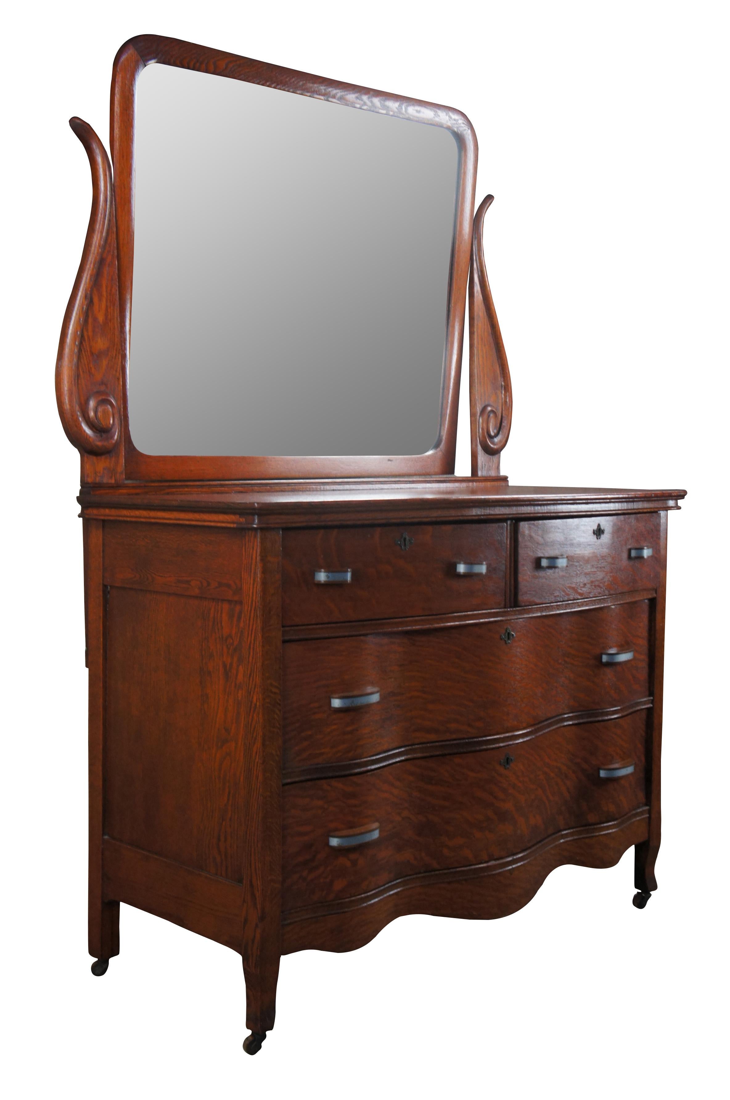 Late 19th century oxbow chest and wishbone mirror. Features a two over two drawer format with dovetailed drawers and an adjustable mirror. The case is supported by flared legs over casters. Marked Watson's improved case Construction along backside.