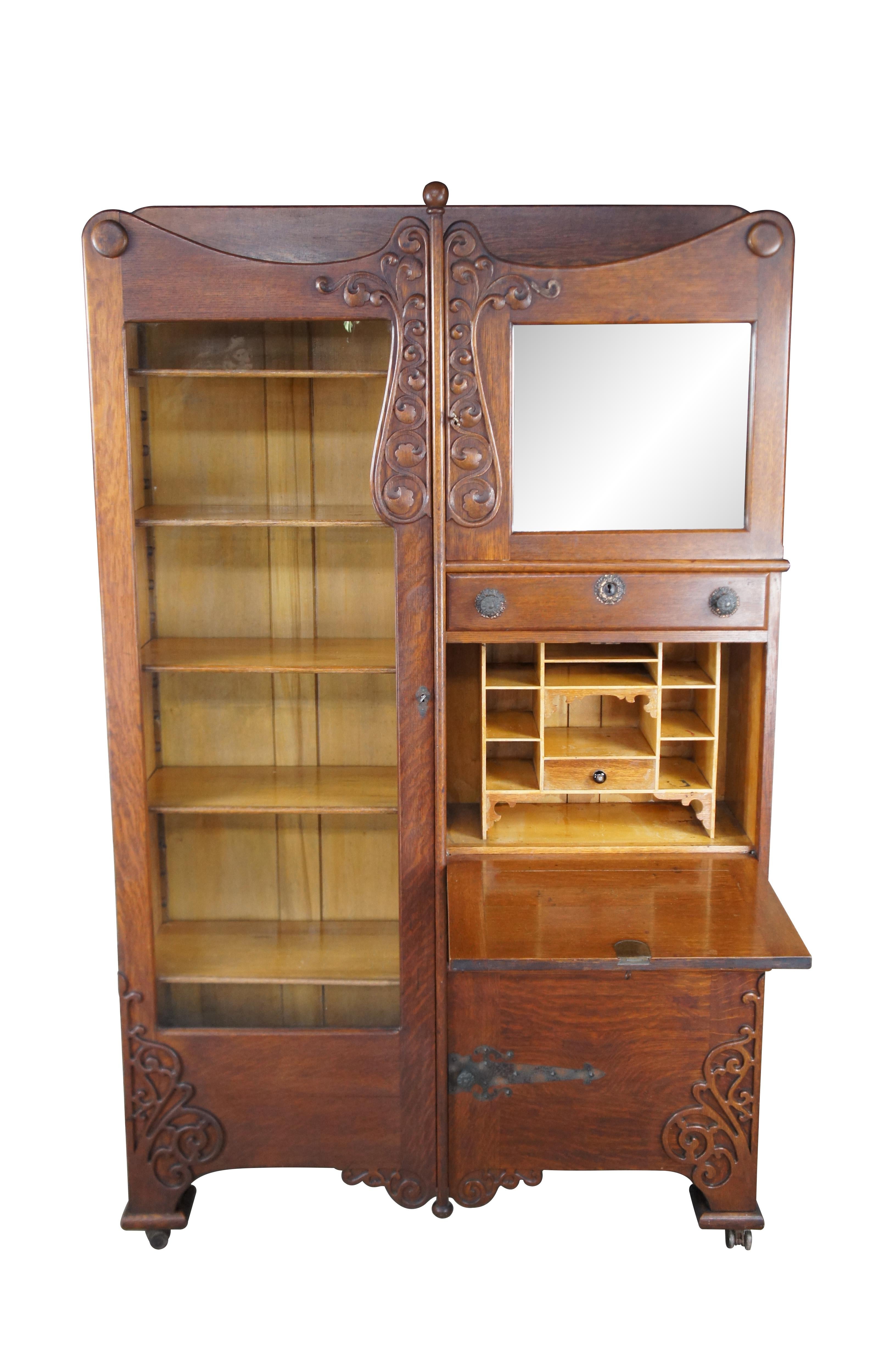 Antique Victorian side by side secretary desk and curio bookcase. Made of quartersawn oak featuring Art Nouveau styling with carved floral and acanthus fretwork accents over a glass front curio cabinet flanking a drop front secretary that opens to