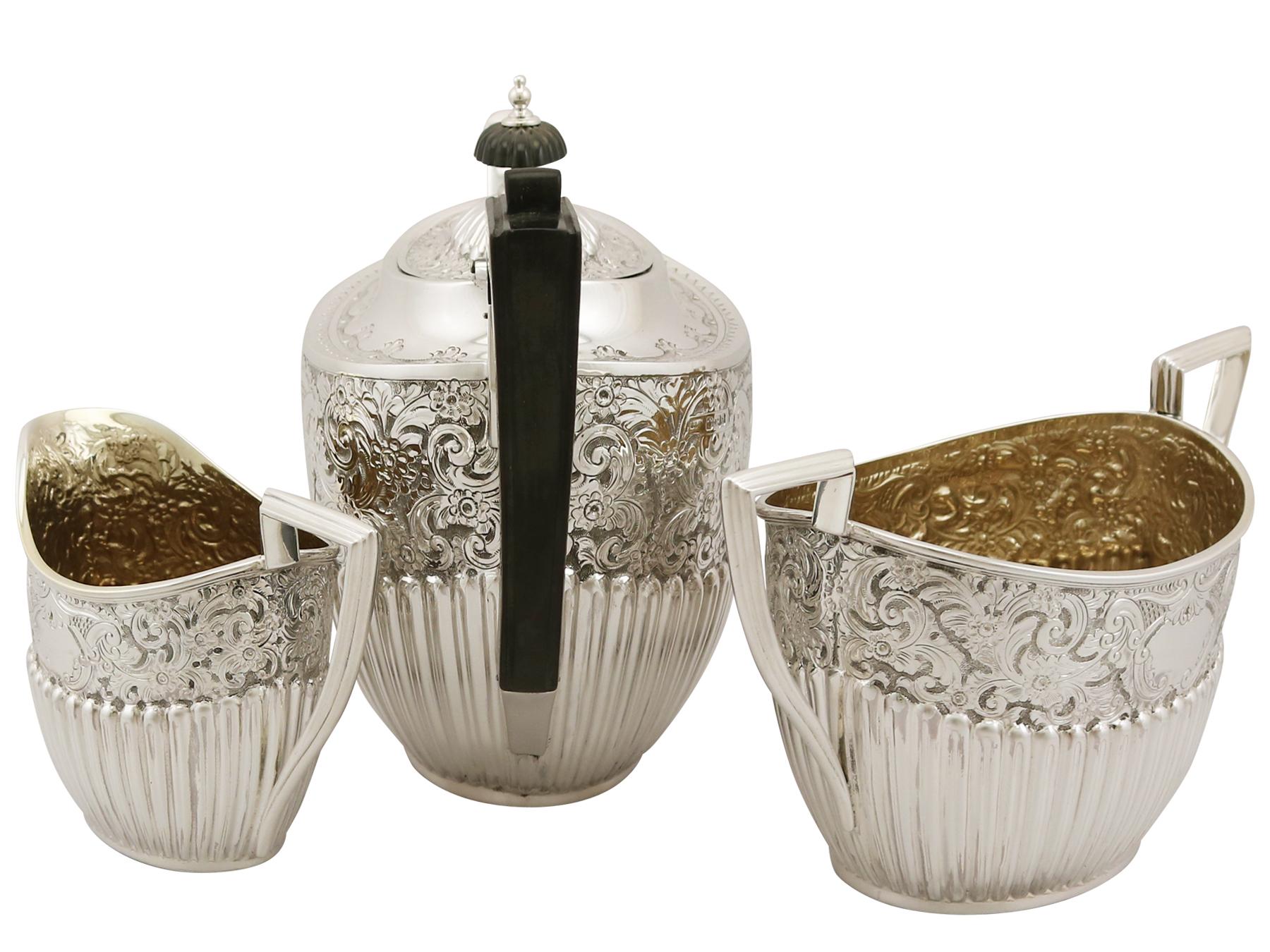 A fine and impressive antique Victorian English sterling silver three piece tea service / set in the Queen Anne style; part of our silver teaware collection.

This impressive antique Victorian sterling silver tea set has been modelled in the Queen
