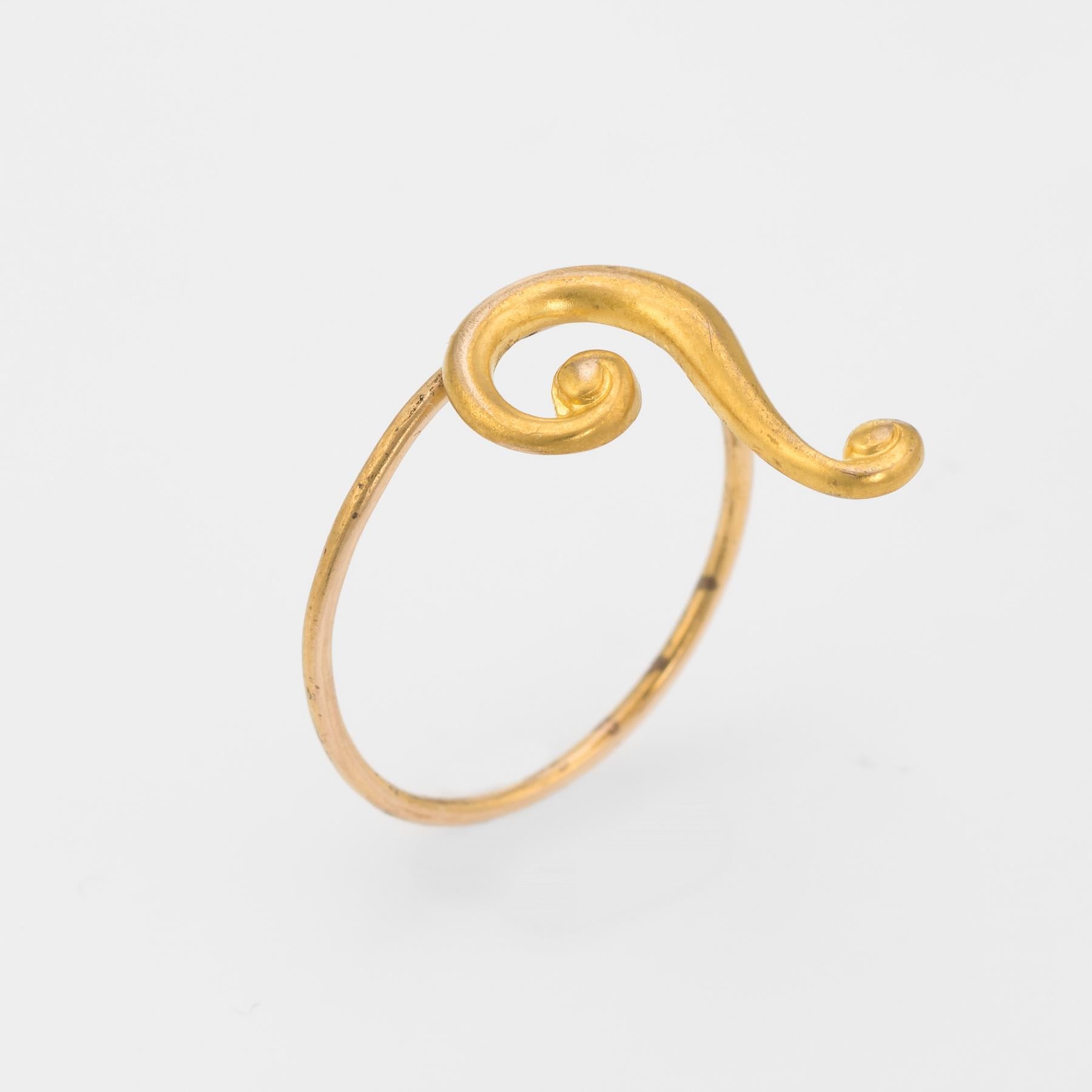 Originally an antique Victorian era stick pin (circa 1880s to 1900s), the question mark is crafted in 10 karat yellow gold. 

The question mark is mounted with the original stick pin. Our jeweler rounded the stick pin into a slim band for the