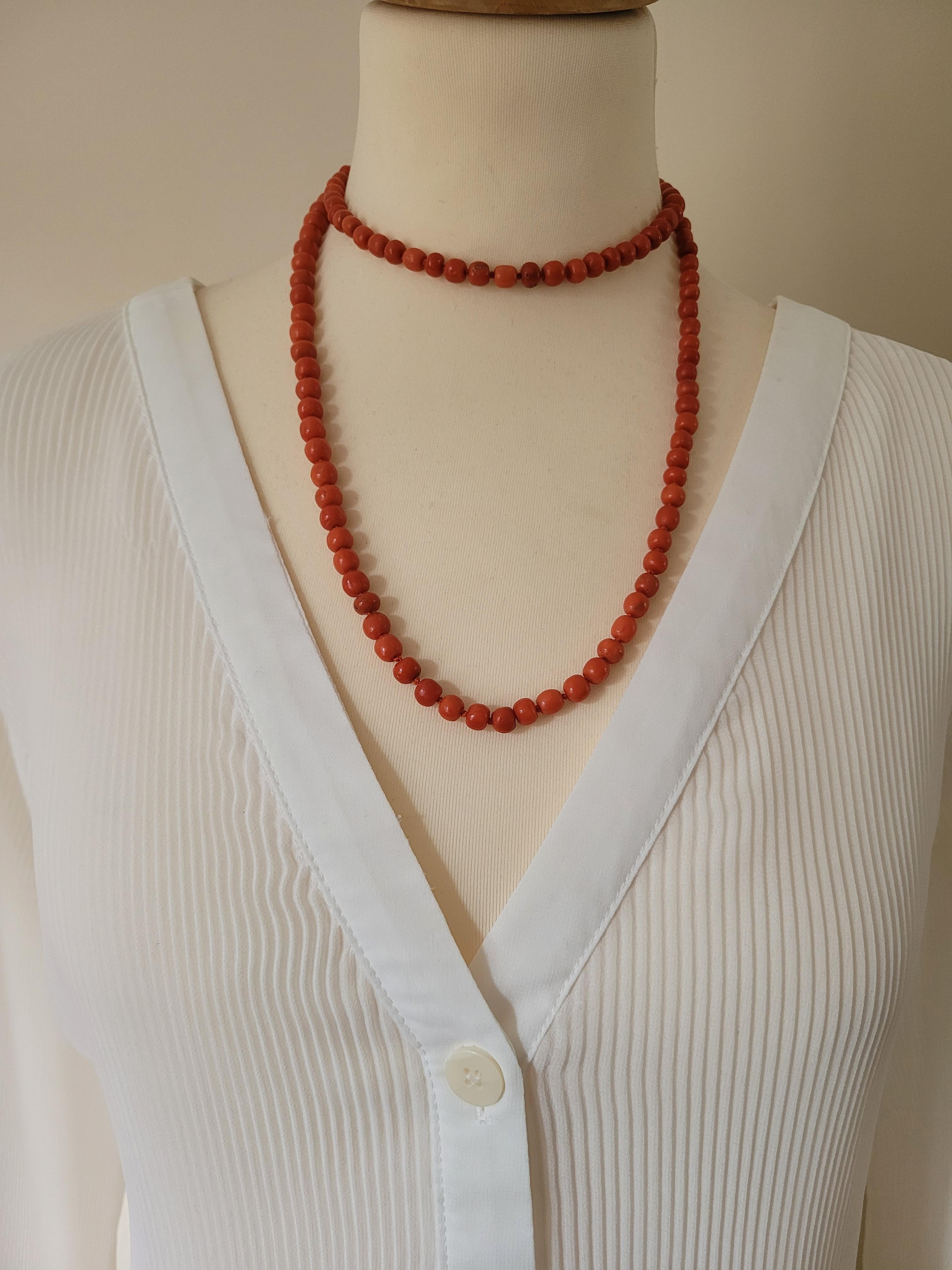 An Antique Victorian c.1880s hand knotted natural Red Salmon Coral Opera length beads necklace on gold color metal bolt clasp. English origin.
Length of the necklace including clasp 38