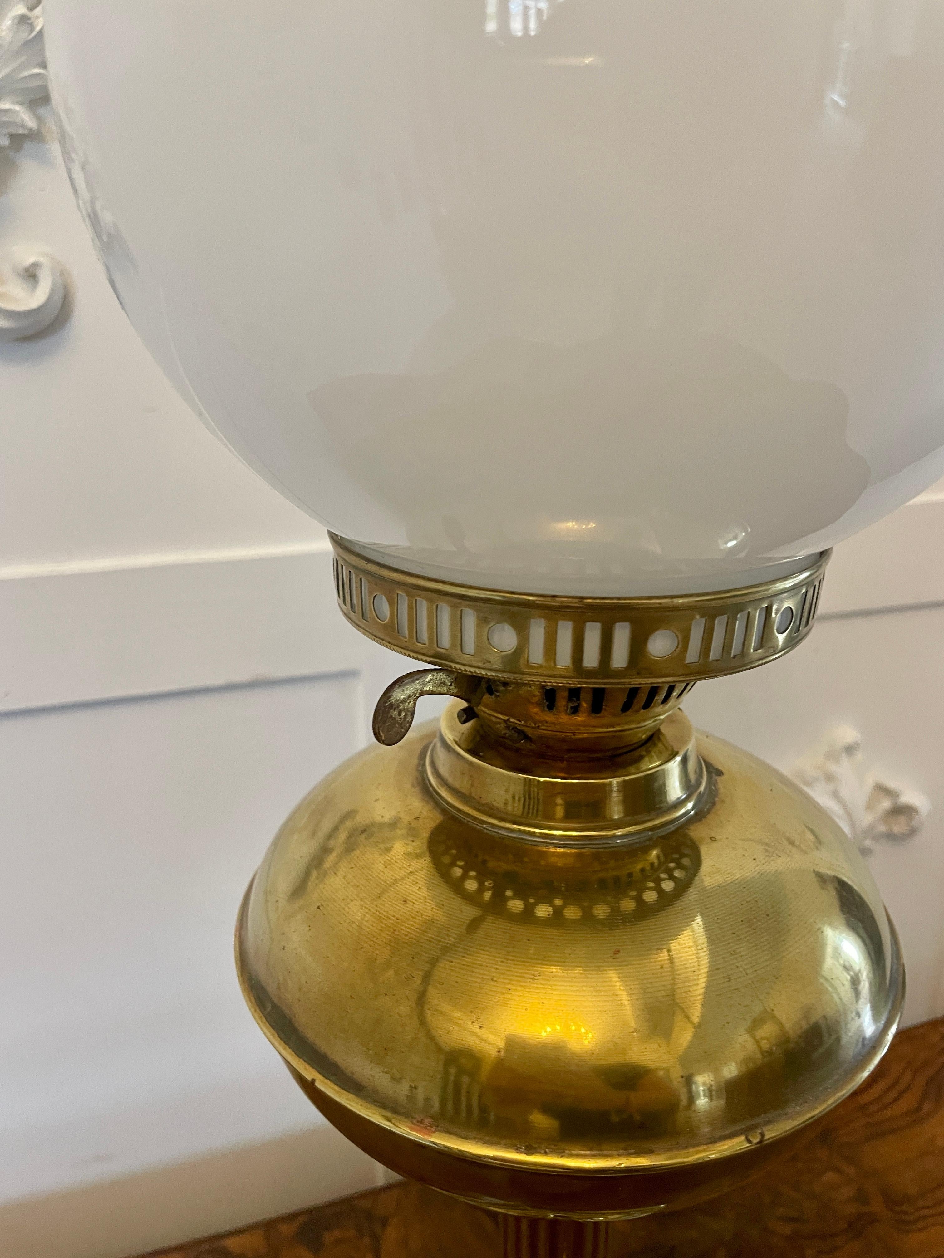 Antique Victorian reeded column quality brass oil lamp having the original glass shade and chimney, double burner,  brass font supported by a reeded column standing on an ornate brass stepped base


Dimensions:
Height 60 cm (23.62 in)
Width 19 cm