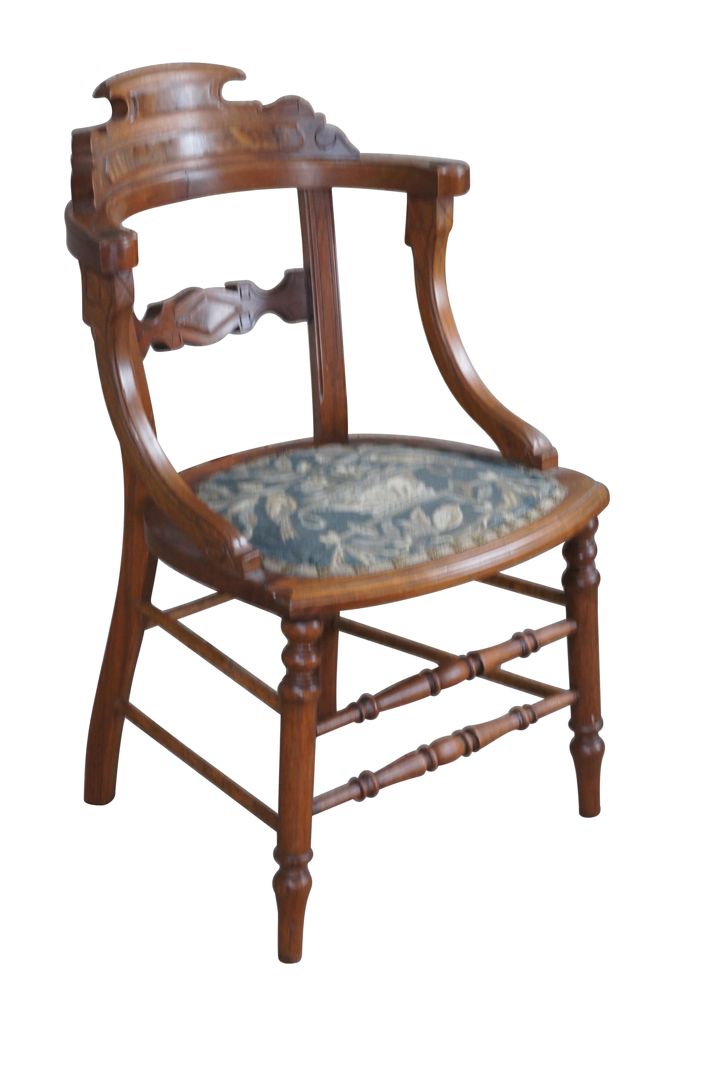 A quaint late 19th century Renaissance Revival side chair.  Made from walnut with burled panels.  Features a curved back with downswept arms and embroidered seat. Seat features a scene of birds and flowers with ornate metal fasteners on the cording.
