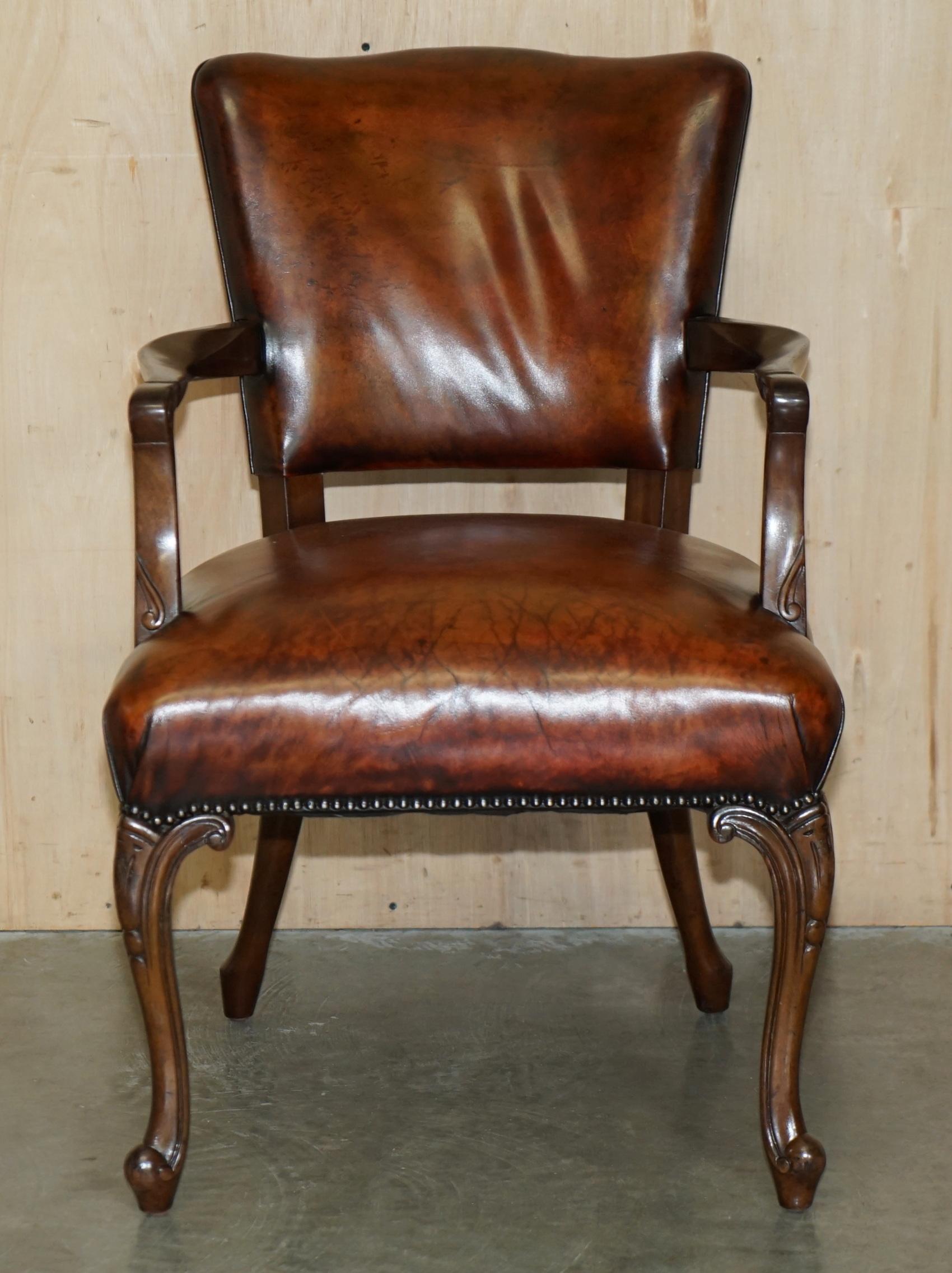 Royal House Antiques

Royal House Antiques is delighted to offer for sale this lovely hand made in England circa 1860 fully restored cigar brown leather carver desk armchair with nicely carved frame

Please note the delivery fee listed is just a