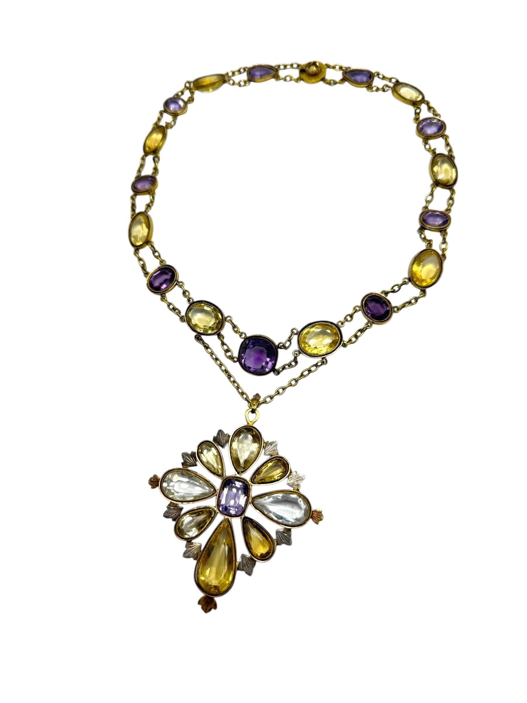 Collar rivière de la época victoriana con una combinación de amatista, citrino y piedras de cristal de roca, cada una engastada en bisel en oro de 9k. El collar está compuesto por 17 piedras preciosas de talla ovalada, unidas por una doble cadena de