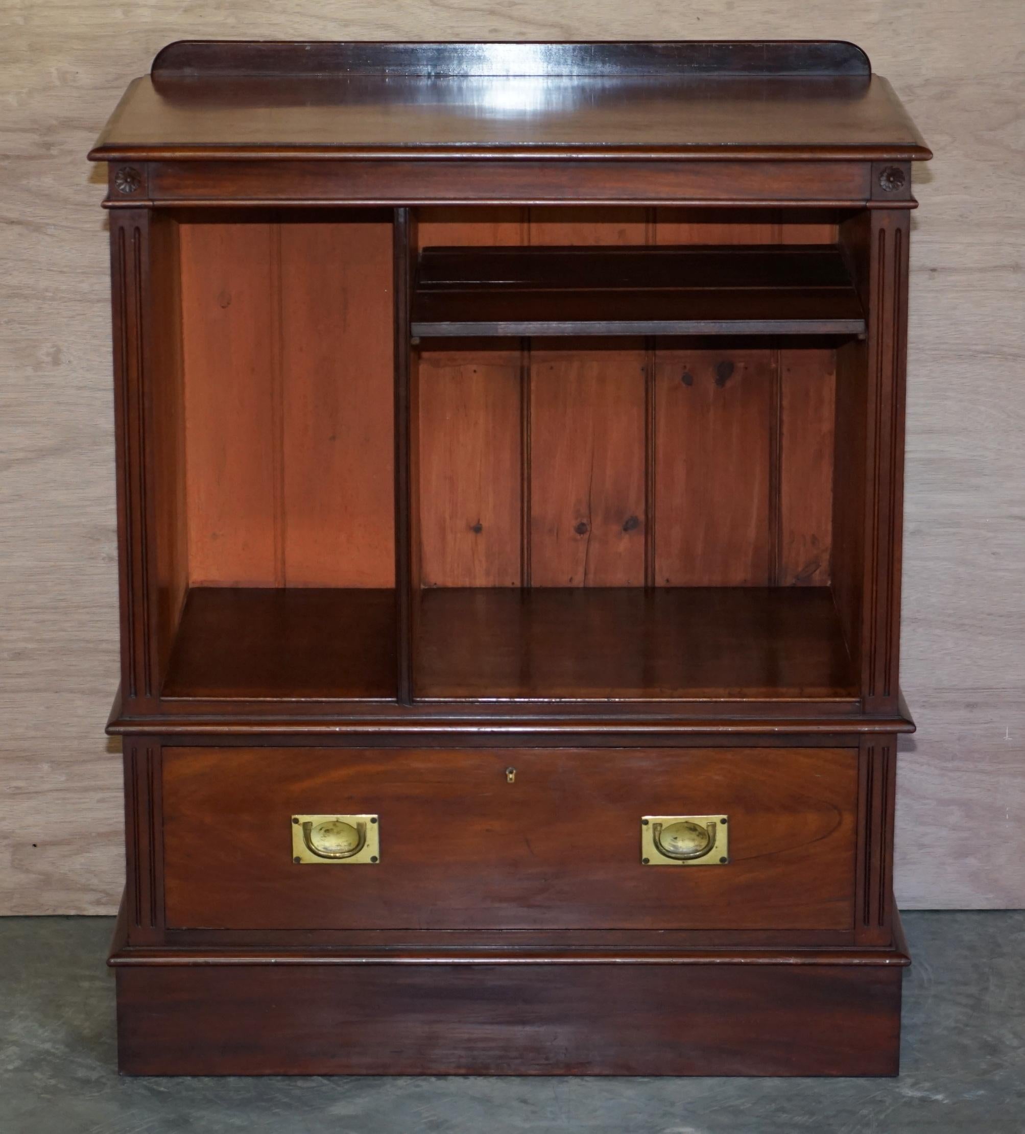 We are delighted to offer for sale this stunning antique Victorian rich mahogany Military Campaign drinks cabinet which can be used as a media entertainment sideboard

A very good looking well made and decorative piece, it has a tall side section