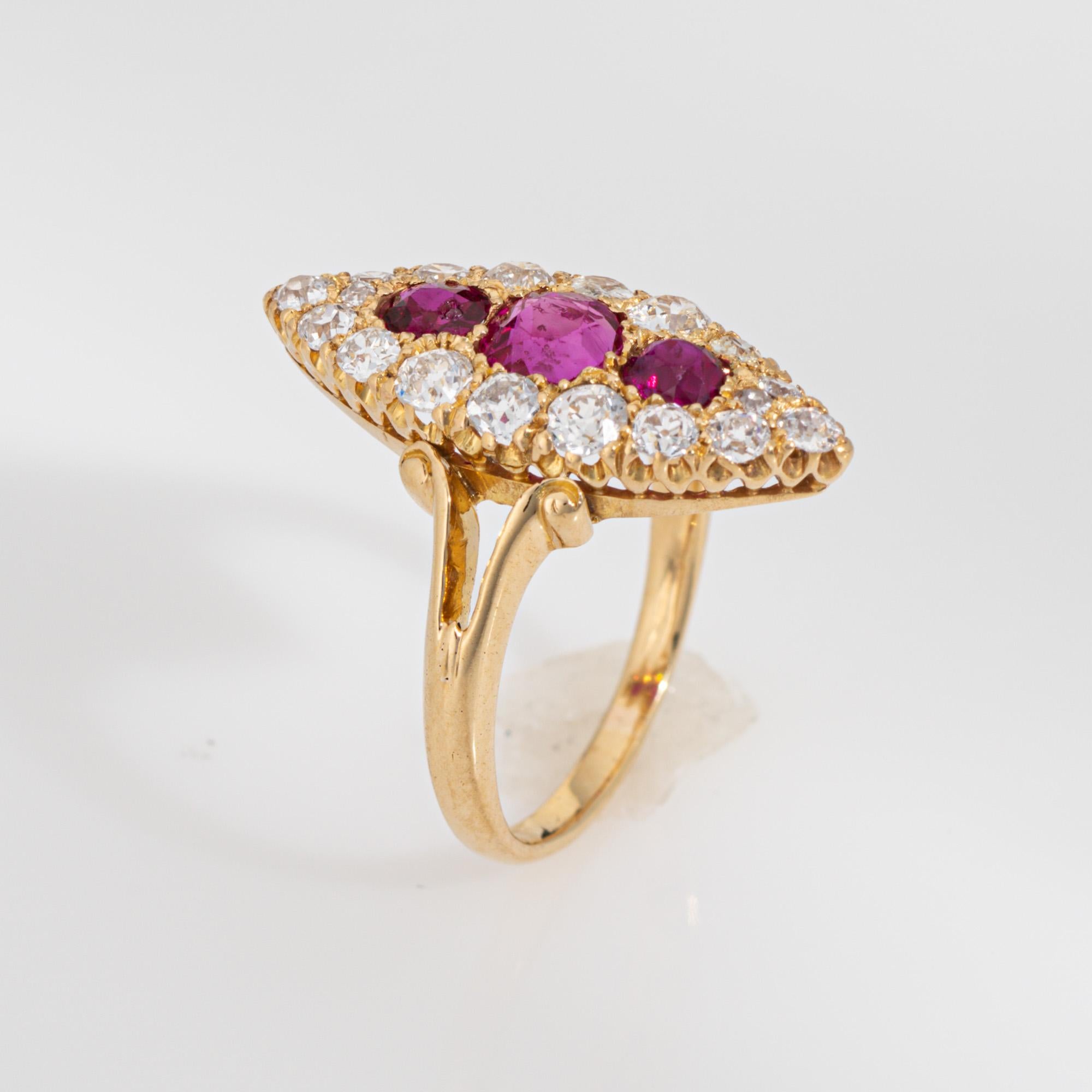 Stylish antique Victorian Burma ruby & diamond navette ring (circa 1880s to 1900s) crafted in 18 karat yellow gold. 

Three Burma rubies total an estimated 0.90 carats. Old mine cut diamonds total an estimated 1.20 carats (estimated at I-J color and