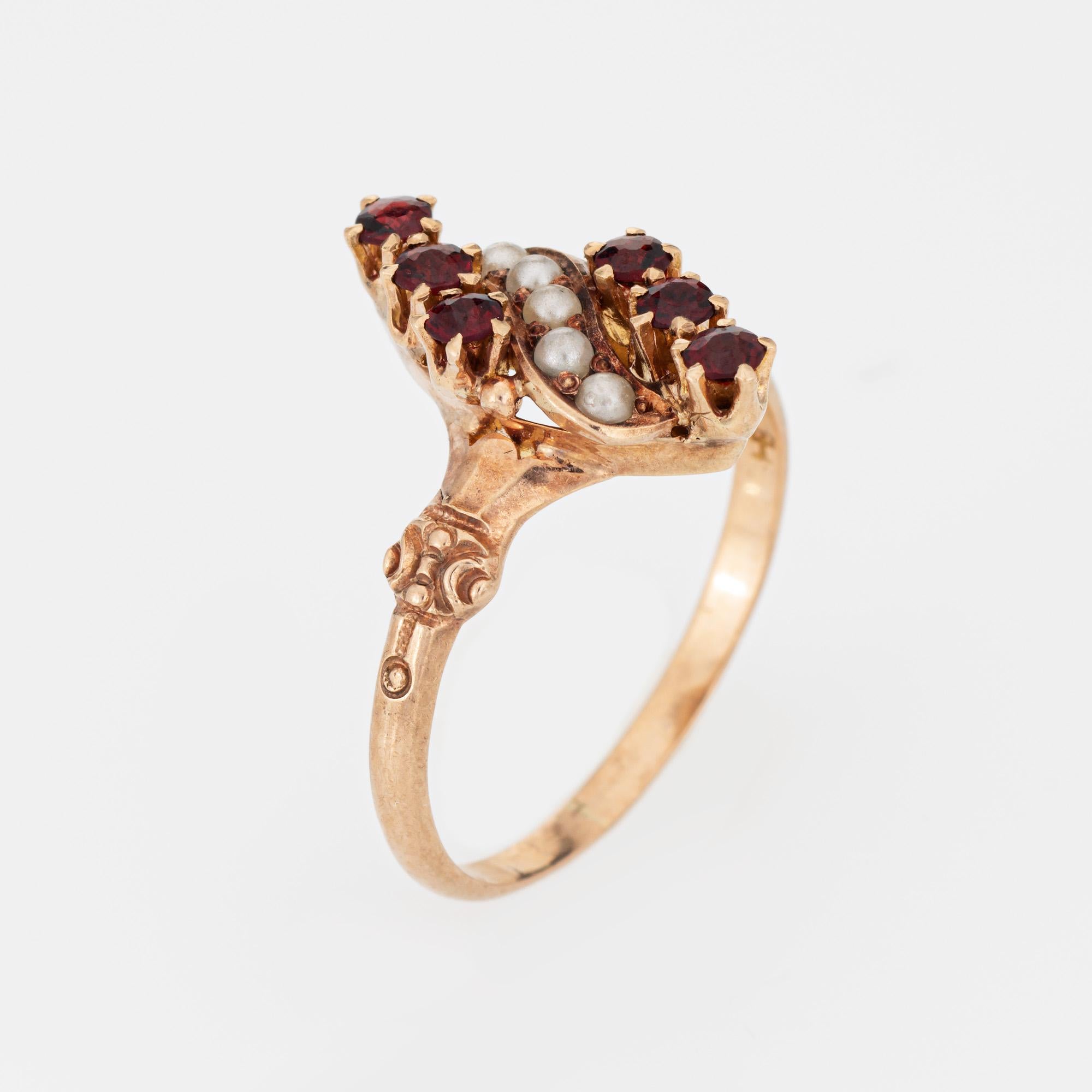 Stylish antique Victorian garnet & seed pearl ring (circa 1880s to 1900s) crafted in 14 karat rose gold. 

Six garnets measure 2mm each, accented with 1.5mm seed pearls. The garnets are in good condition and free or cracks or chips (light surface
