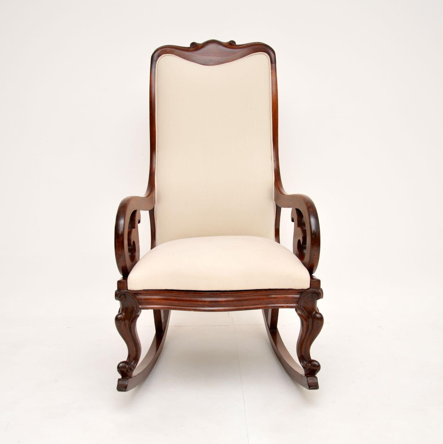 A smart and beautifully made antique Victorian rocking chair. This was made in England, it dates from around the 1860-1880 period.

It is of superb quality and is very comfortable. The frame has a gorgeous, sweeping design and looks great from