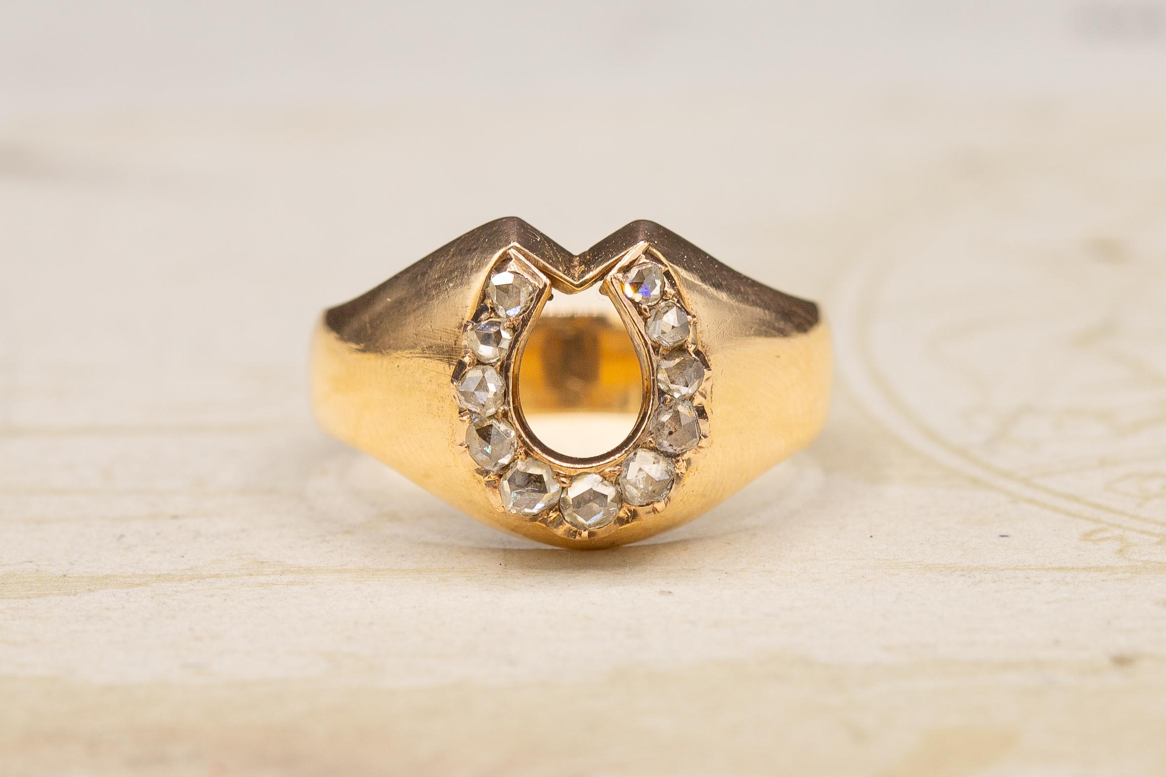 This antique Victorian era rose cut diamond horseshoe ring was made in Austro-Hungary, circa 1900. 

This utterly charming signet ring features a horseshoe motif at the front of the bezel. The motif has symbolised luck and fortune for centuries. The