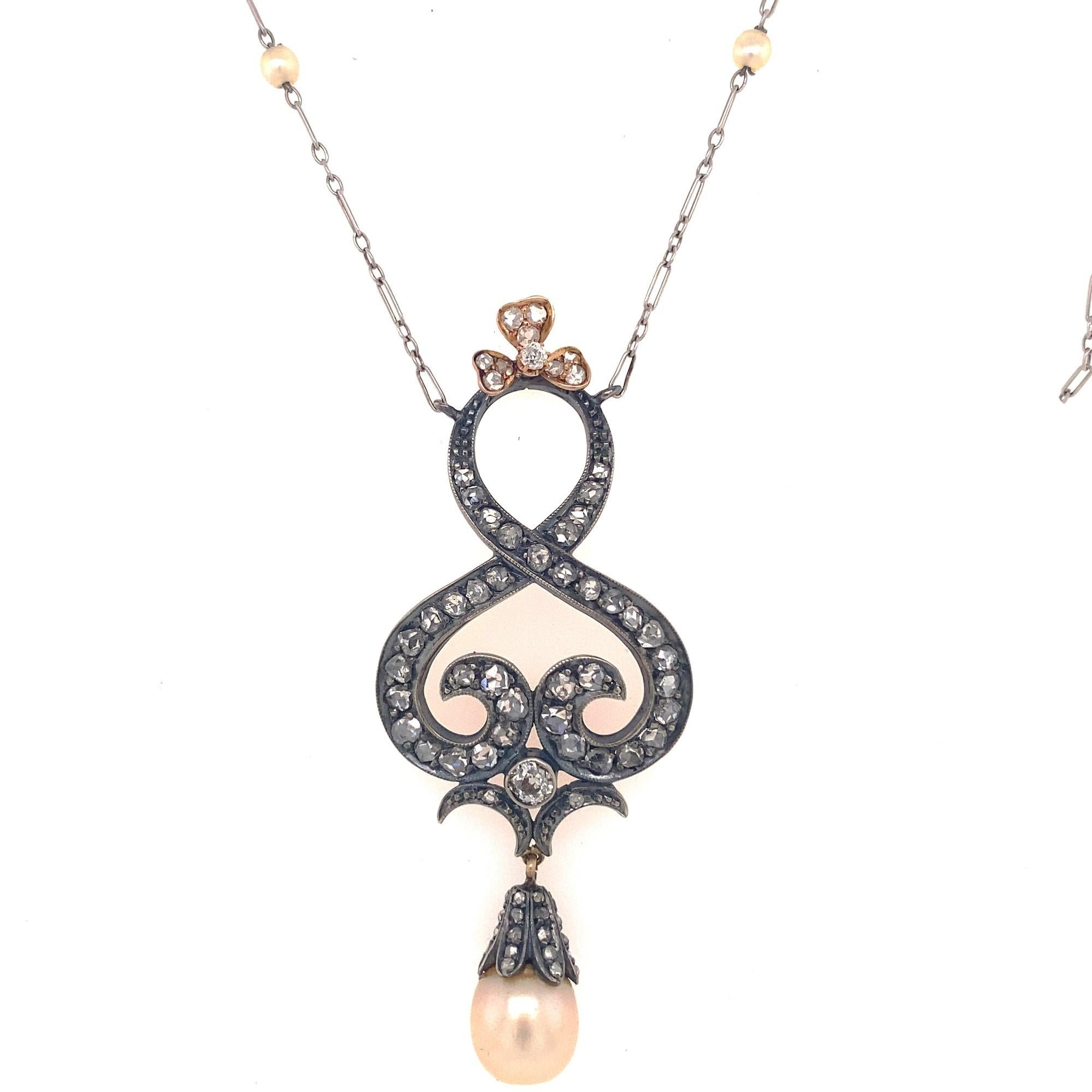 This is a beautiful antique Victorian pendant set with rose cut diamonds and pearls. There is 2 old mine cuts and 73 rose cut diamonds approximate total diamond weight 2.68 carats. The rose cut diamonds average I color SI-1 clarity, old mine cut