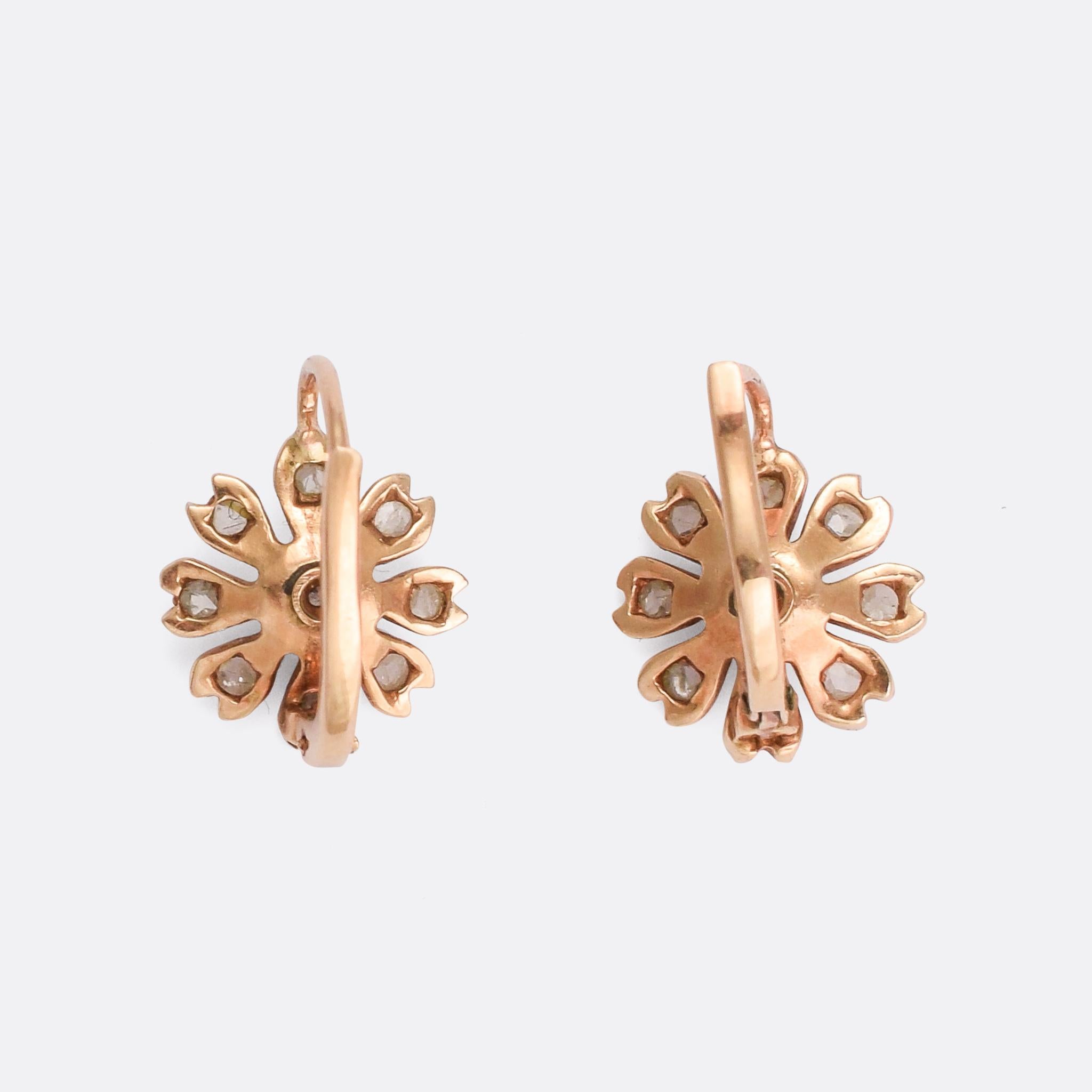 The prettiest pair of diamond flower earrings... dating from the late Victorian era they're modelled in 14k rose gold and set with white diamonds - likely of Swiss origin. They're very sweet, and very wearable.

STONES 
Old Mine Cut Diamonds and